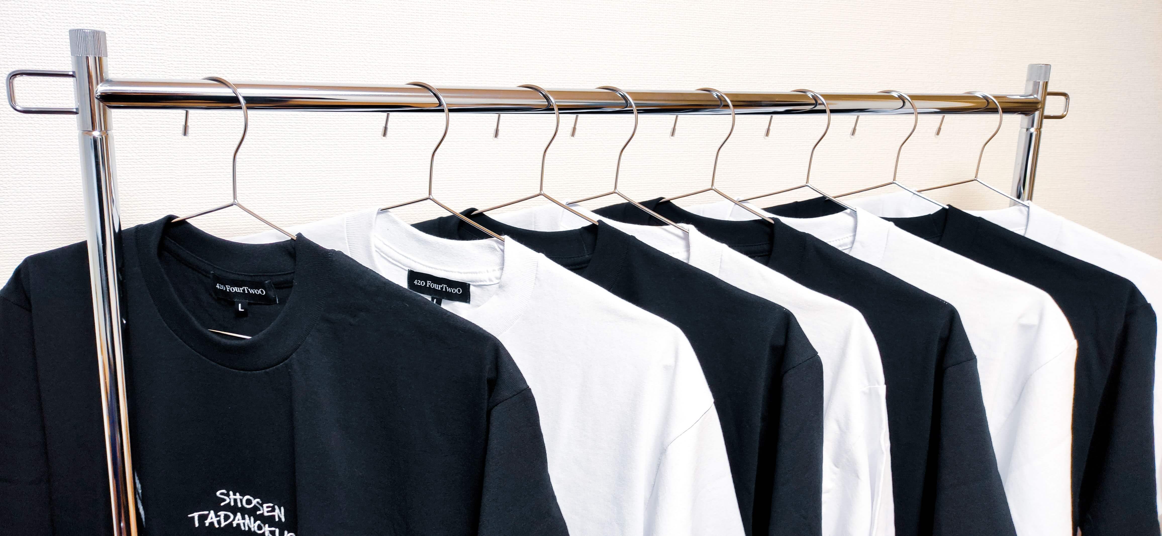 Black and white T-shirts on a rack