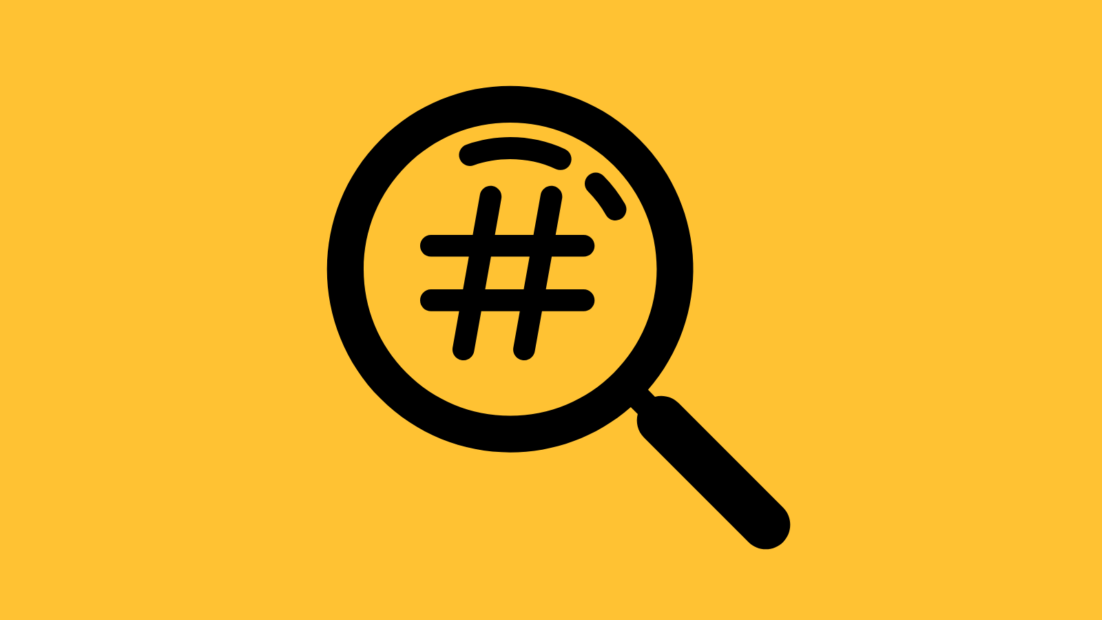 A magnifying glass looking at a hashtag