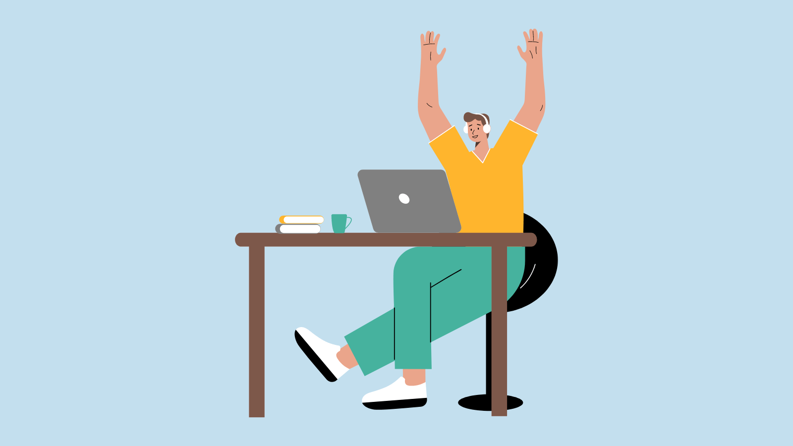A person sitting at a desk throwing their hands up in celebration