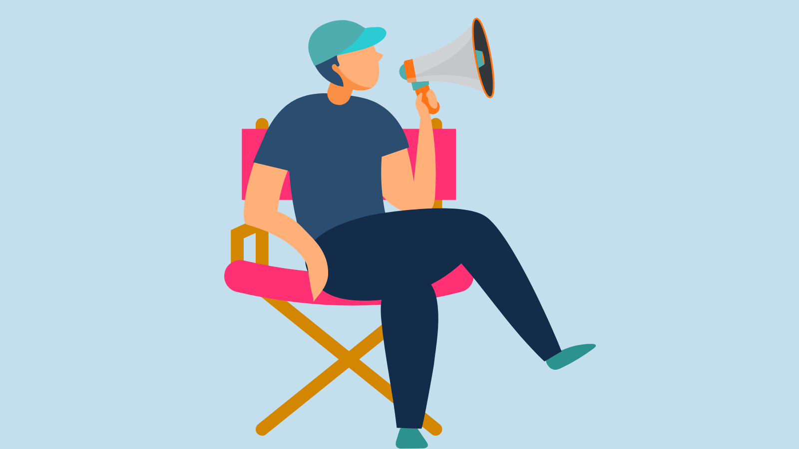 A person sitting in a directors chair holding a megaphone