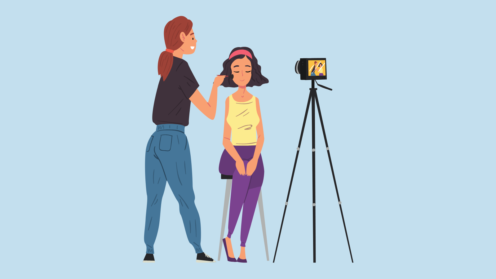 A woman putting blush on a young girl while a camera records