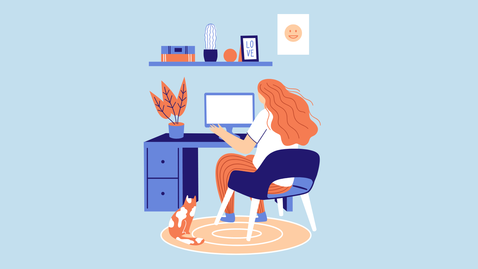 A woman working from home with a cat by her feet