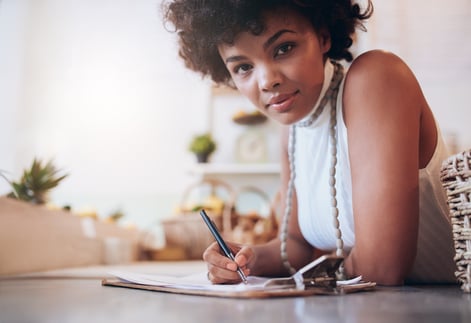 business owner taking notes on a clipboard