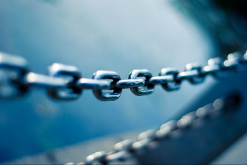 Chain links on dark blue background