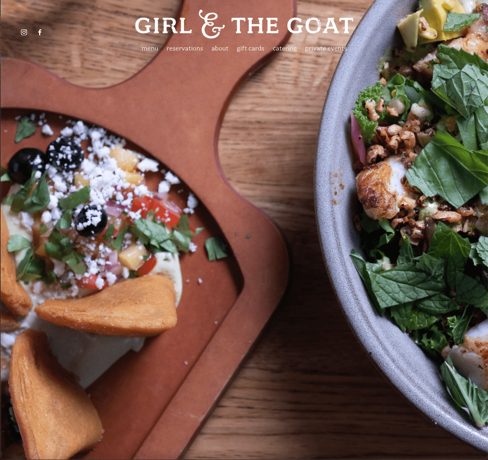 Girl and the Goat homepage featuring an artfully staged photo of a meal