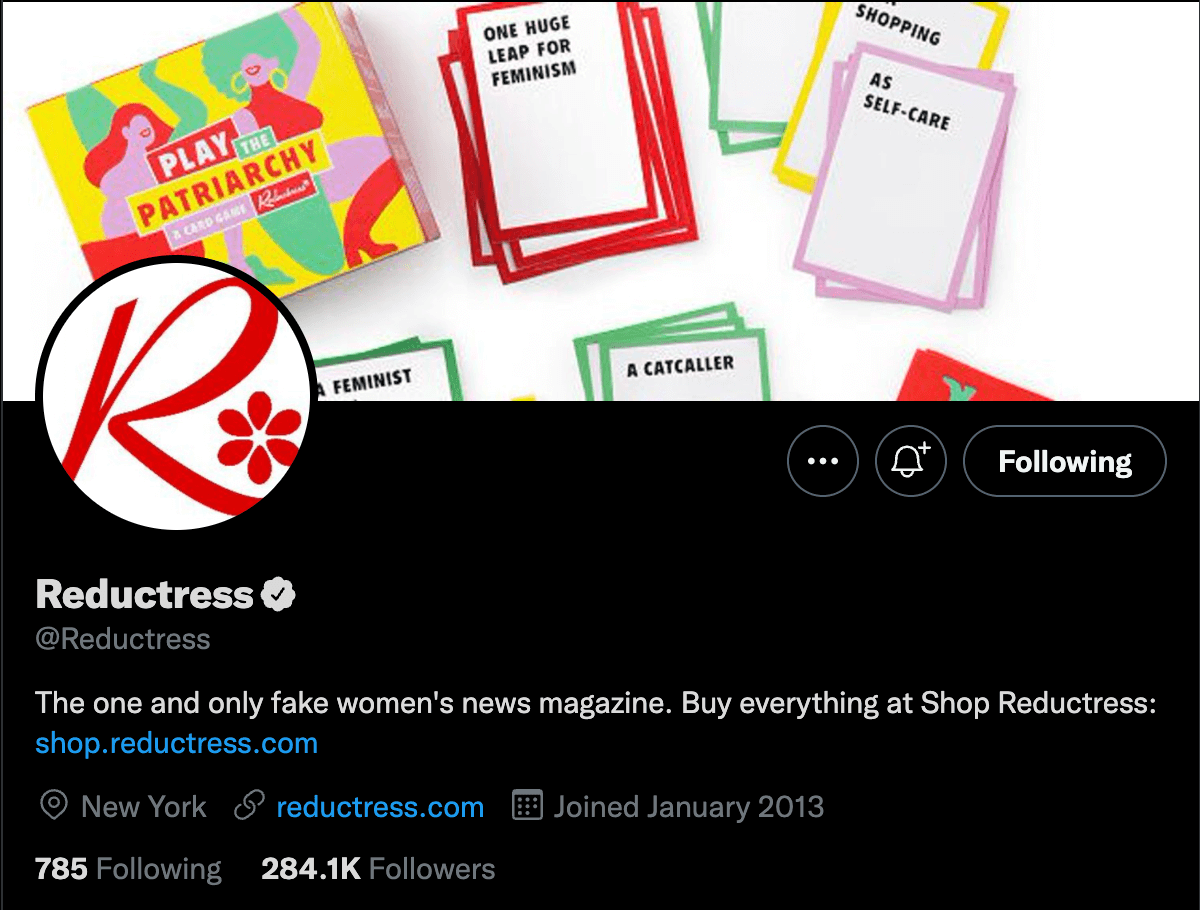 The Twitter profile for Reductress. The Profile photo is their logo, the cover photo is their new card game. The bio reads "The one and only fake women's news magazine" and links to their merch shop. Their location is New York and the link symbol includes their website. 