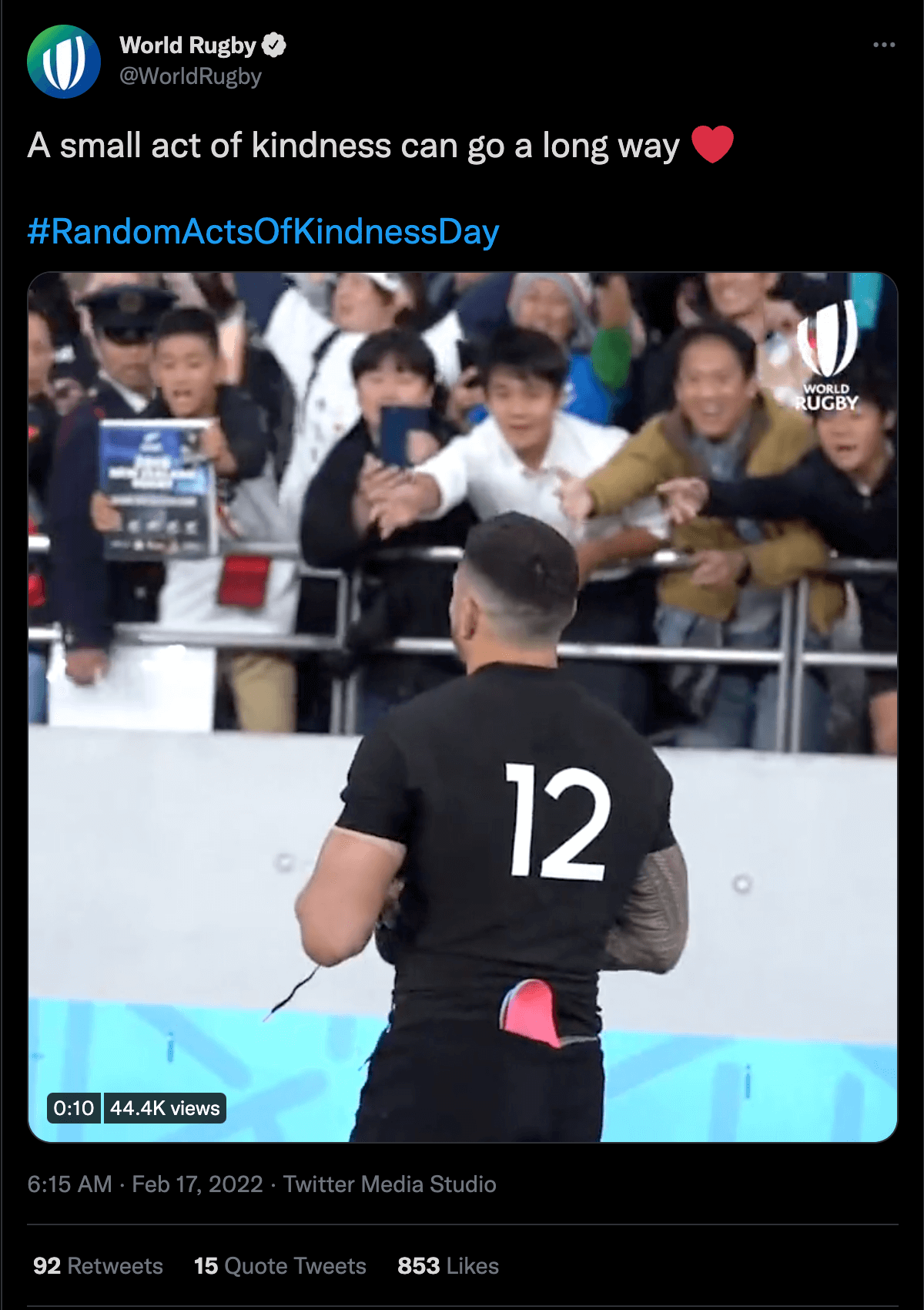 A tweet from World Rugby. The video shows a player with his back to the camera, the caption reads "A small act of kindness can go a long way #RandomActsOfKindnessDay