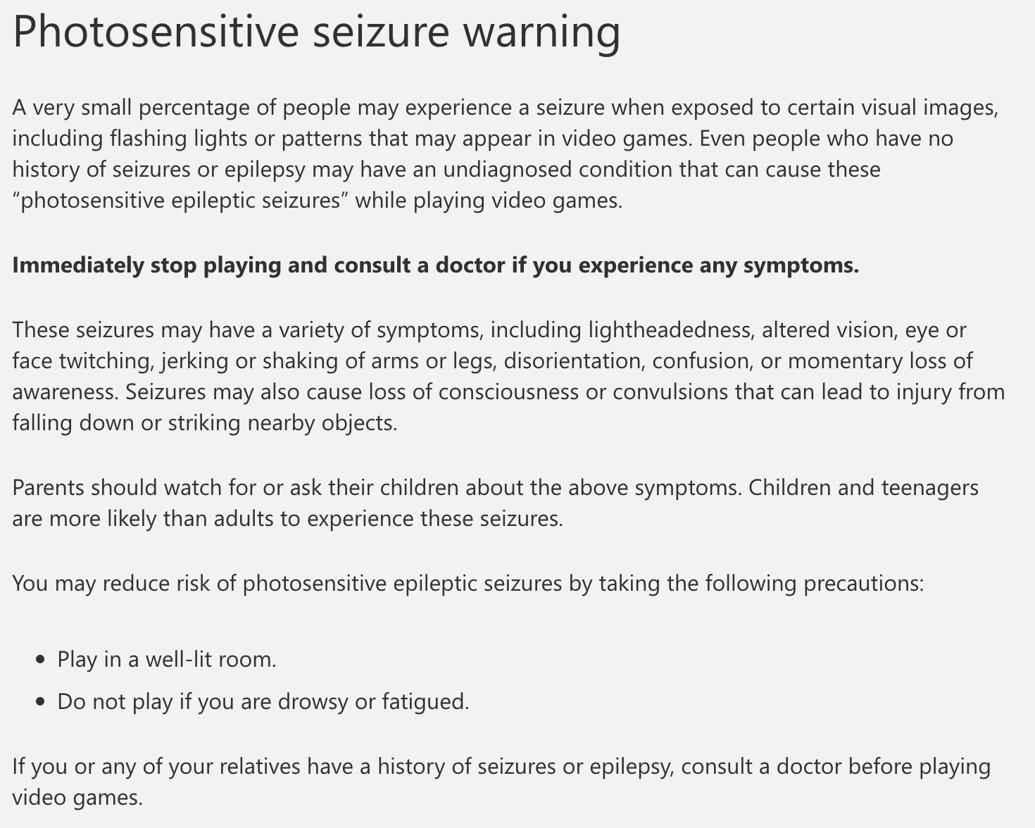 A photosensitive seizure warning for XBox. It includes an explanation of what photosensitive seizures are and instructs users to stop playing immediately and see a doctor if they experience symptoms.