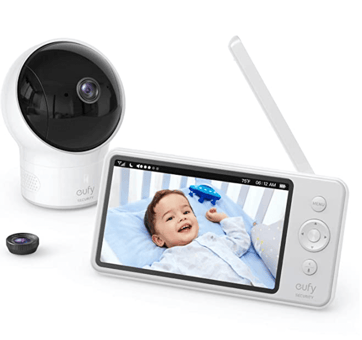 A camera and baby monitor screen showing a smiling baby in a crib. 