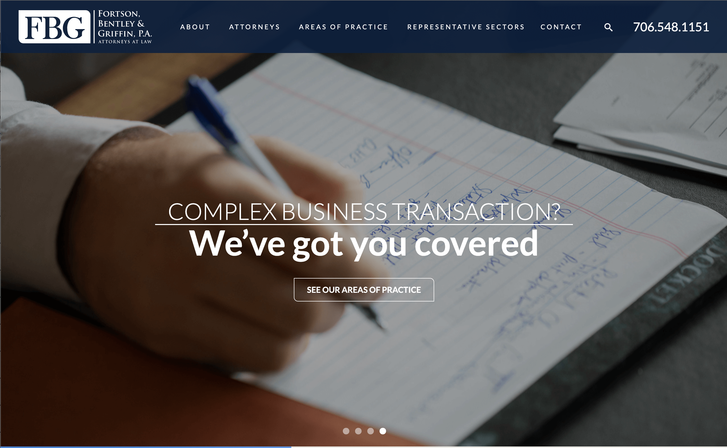 FBG's website featuring the words "complex business transaction? We've got you covered" over a closeup photo of a hand writing on a legal pad