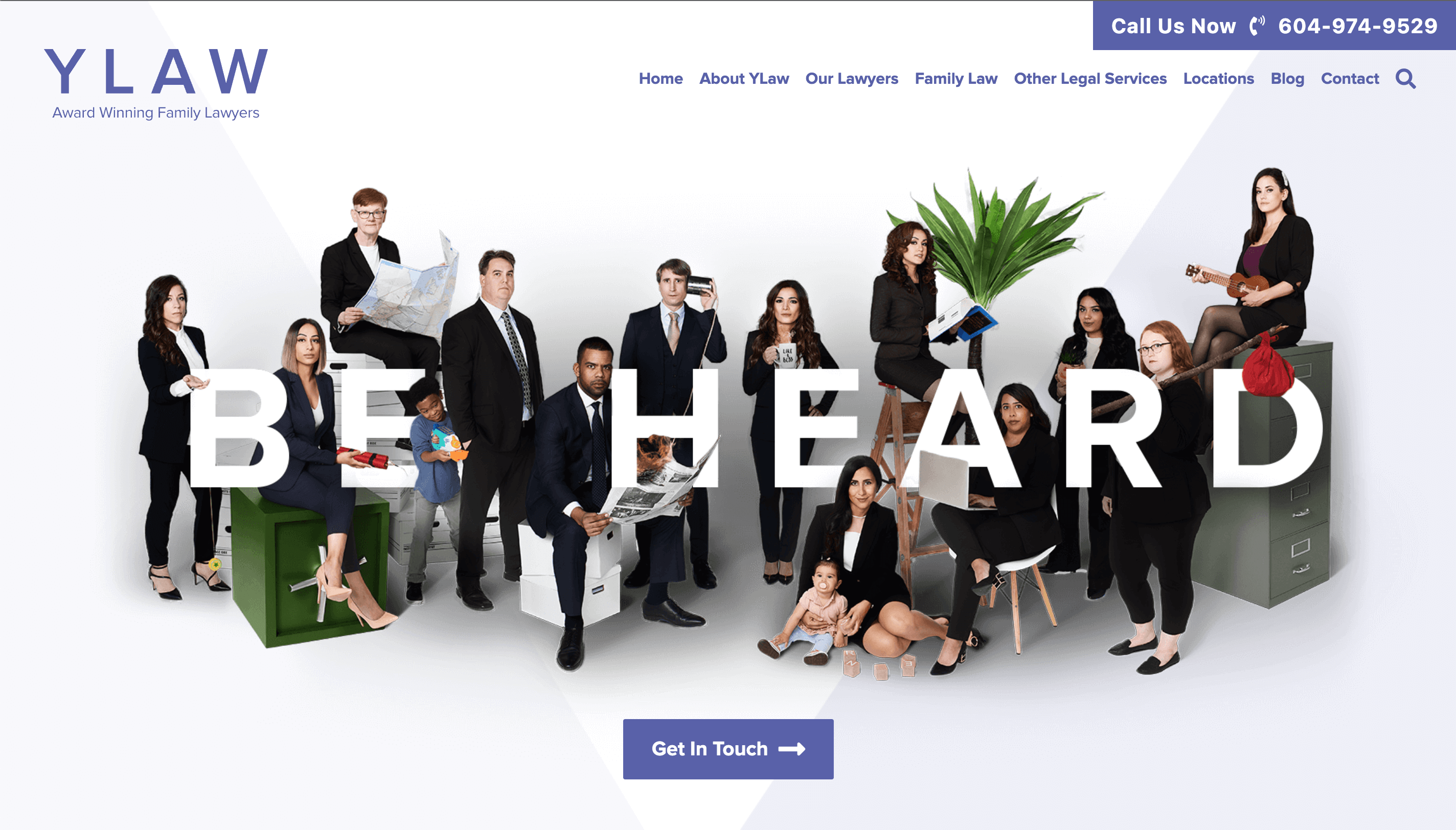 YLAW group's homepage featuring a photo of the attorneys, their kids, and various props sitting among the words "BE HEARD"