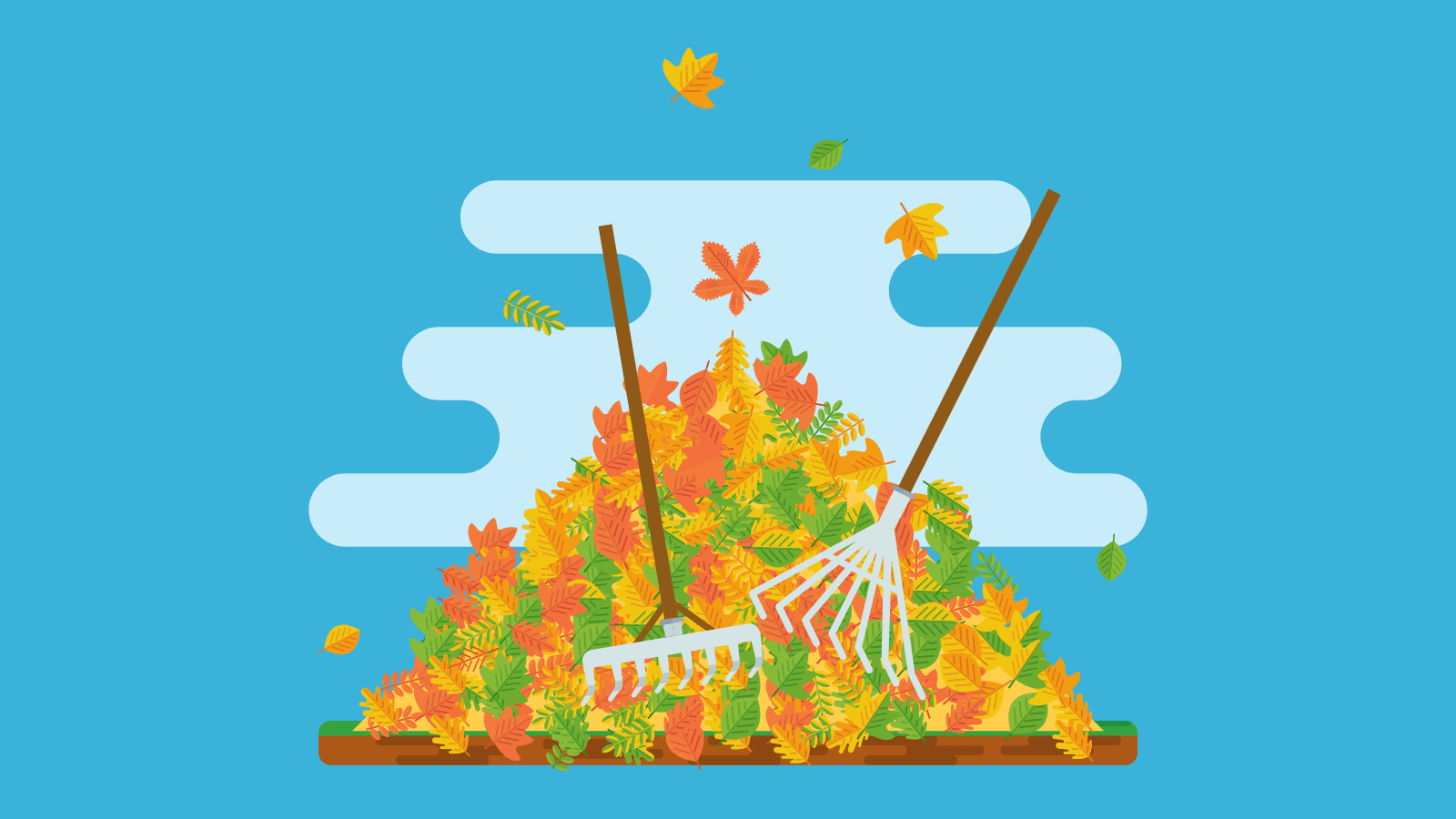 Two rakes resting on a pile of leaves