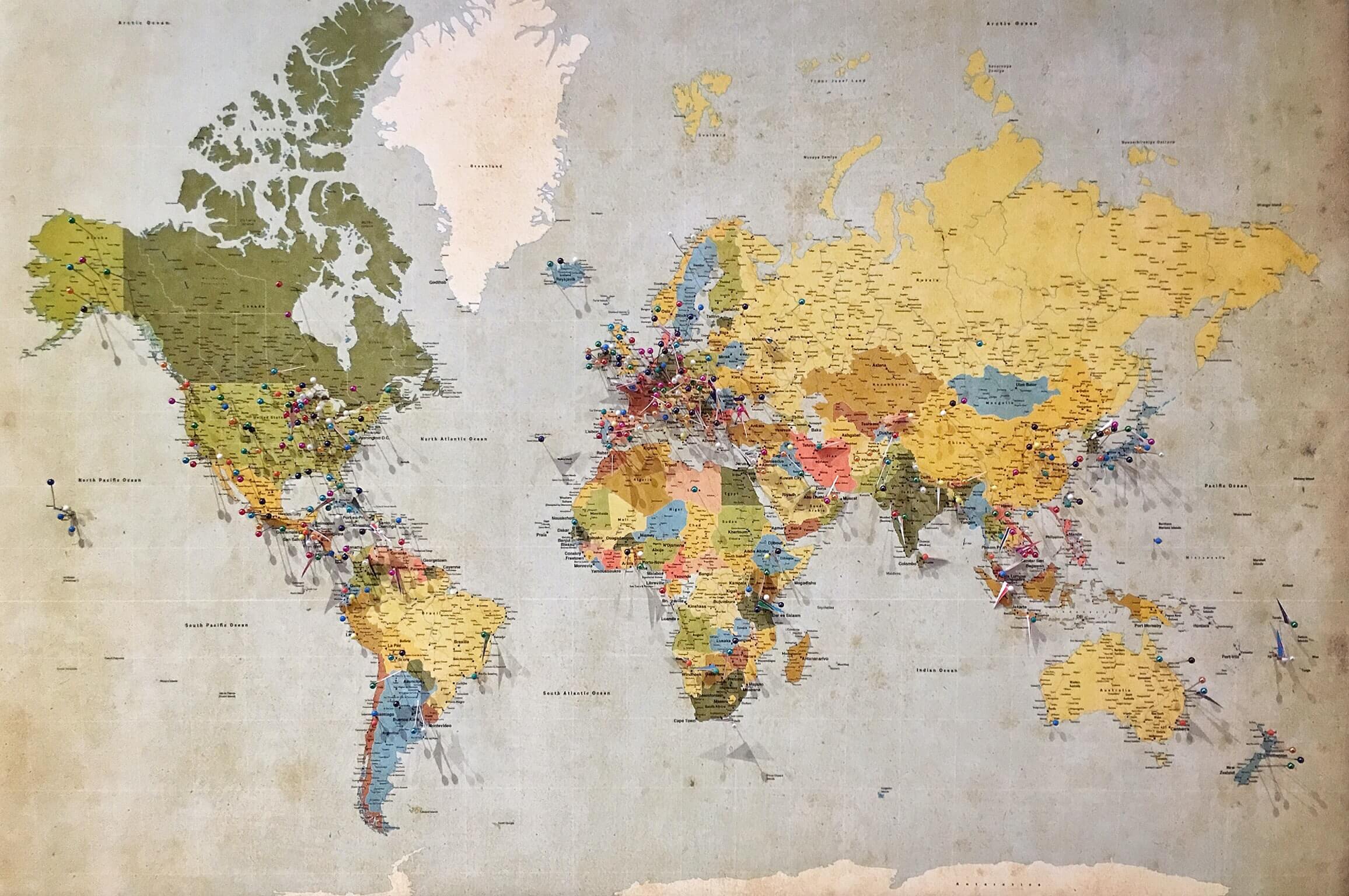 A map of the world with pins all over it