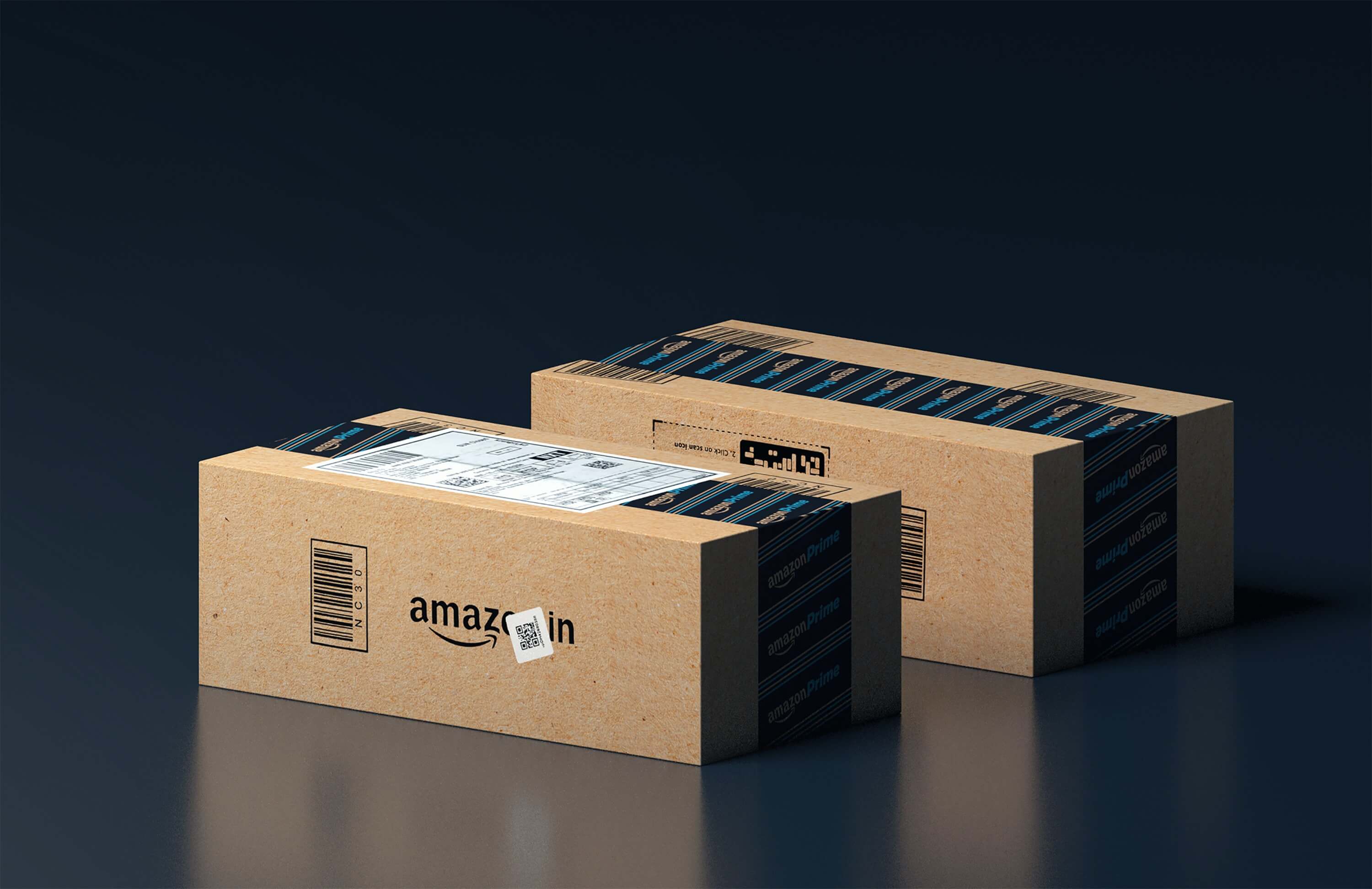 Two Amazon boxes against a black background