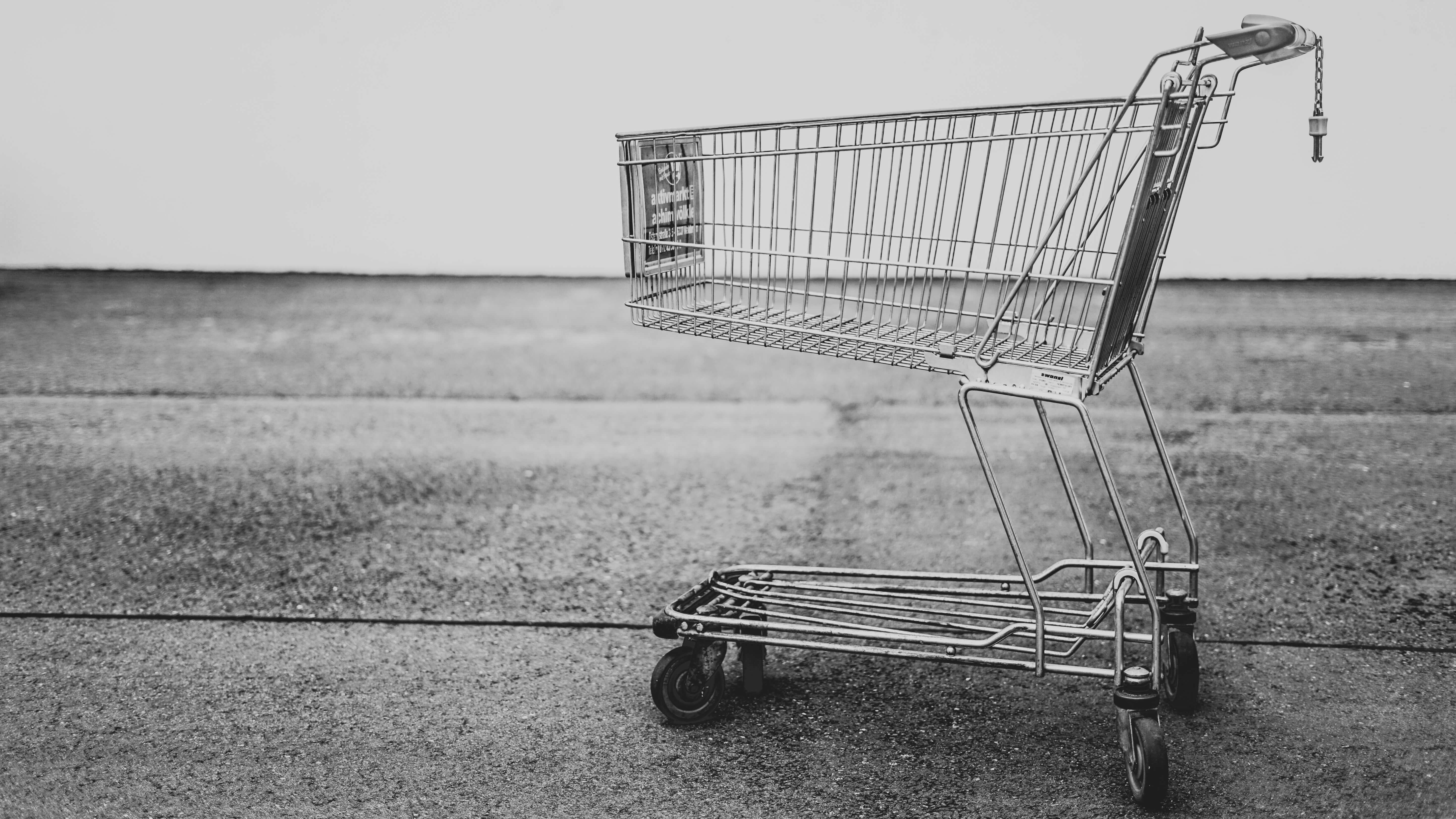 A black and white photo of a shopping cart. 