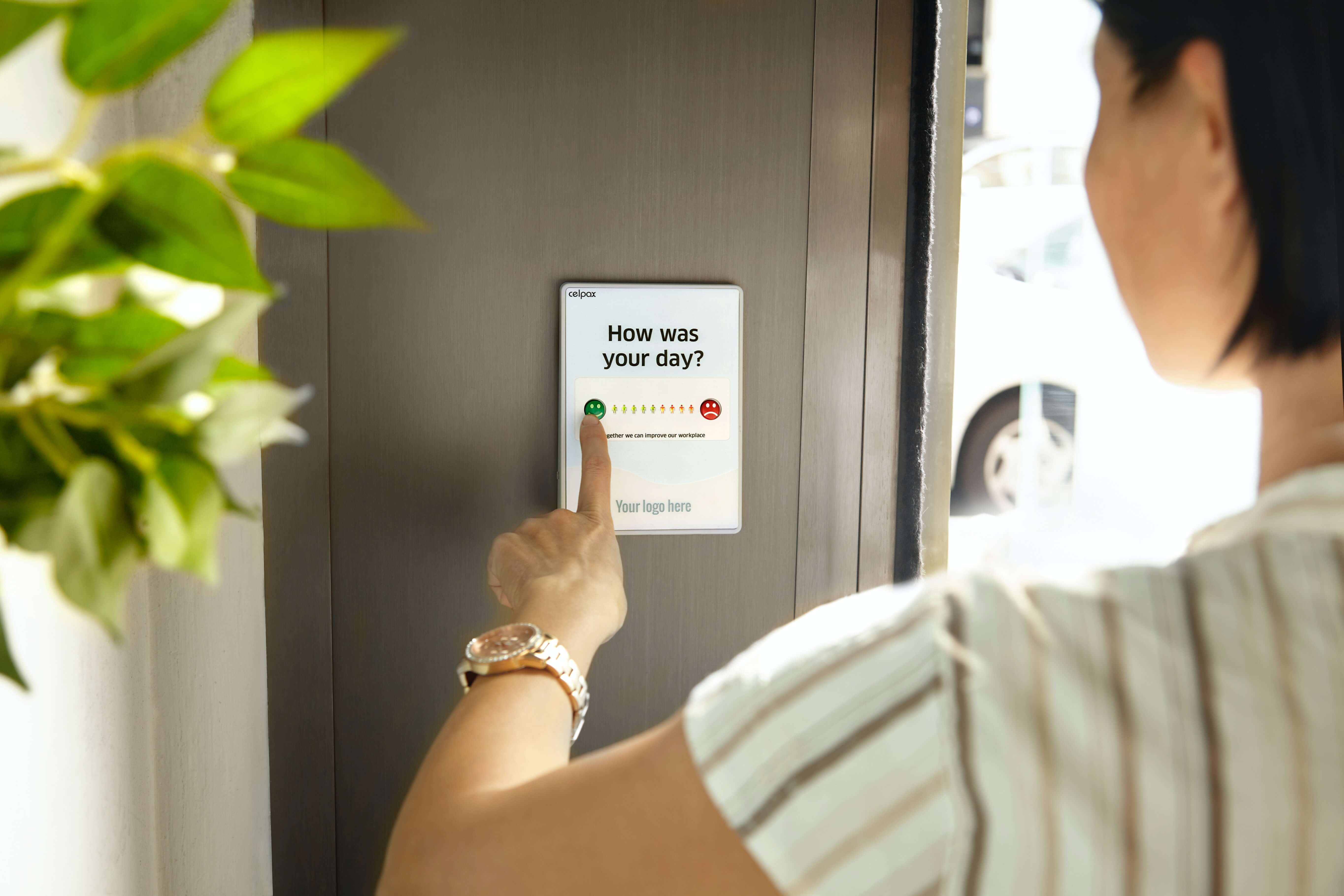 A woman filling out a survey on a tablet