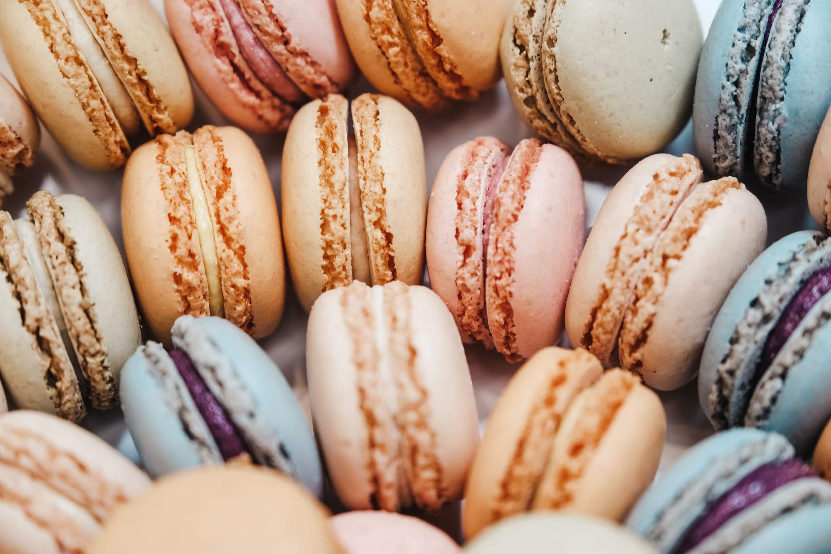 Macarons in various colors arranged in rows