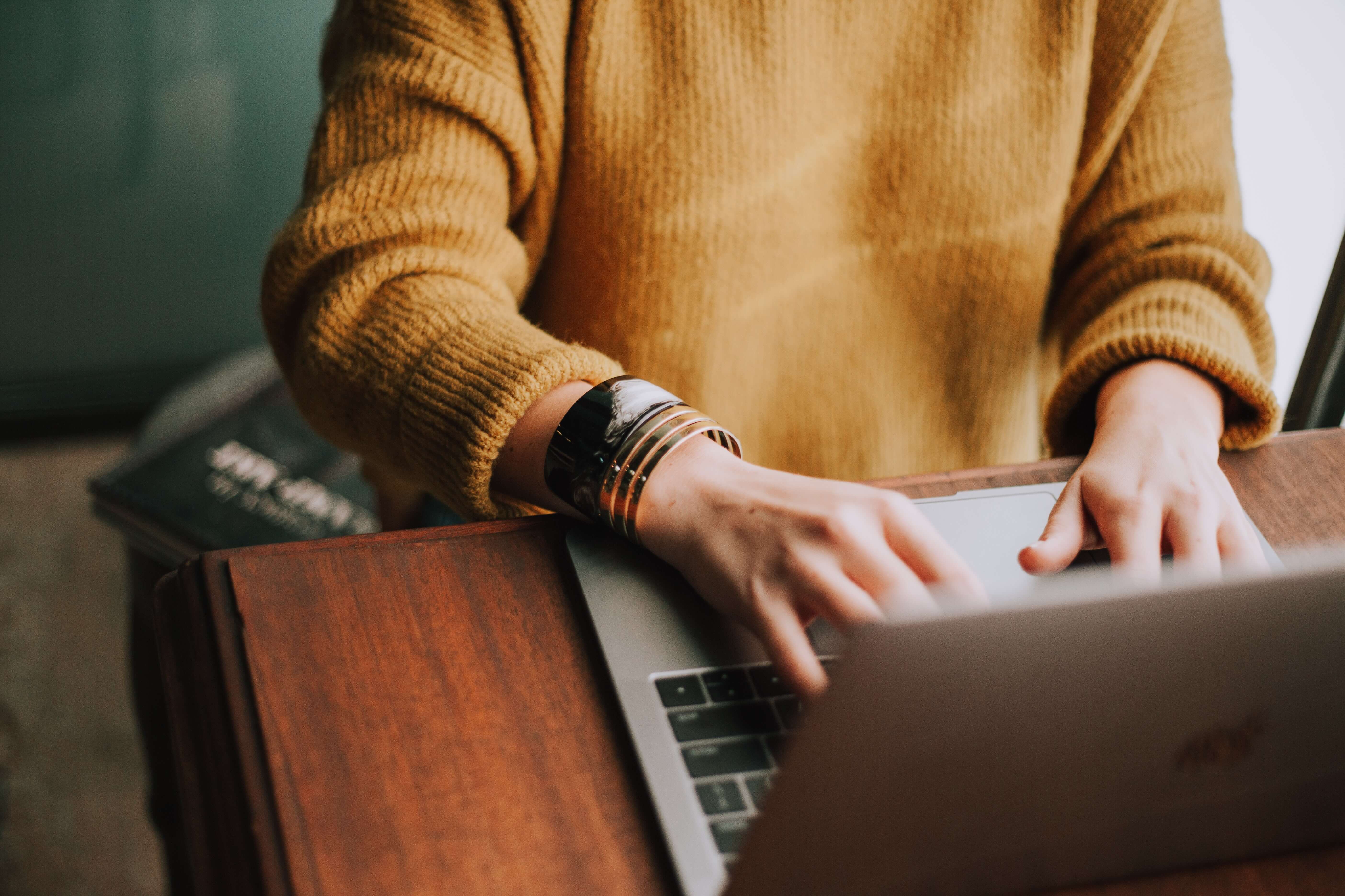 A young person using a laptop