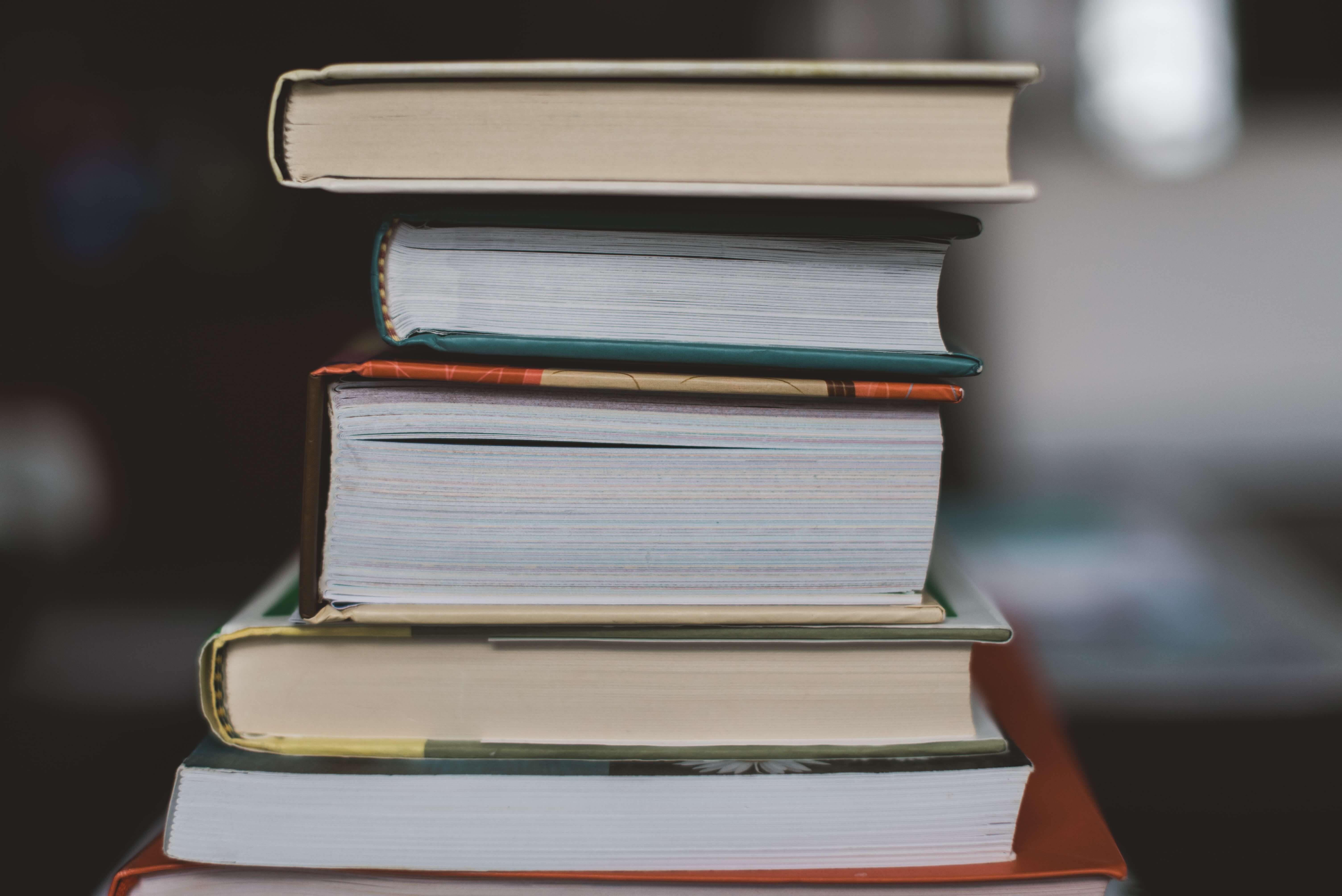 A stack of various sized books