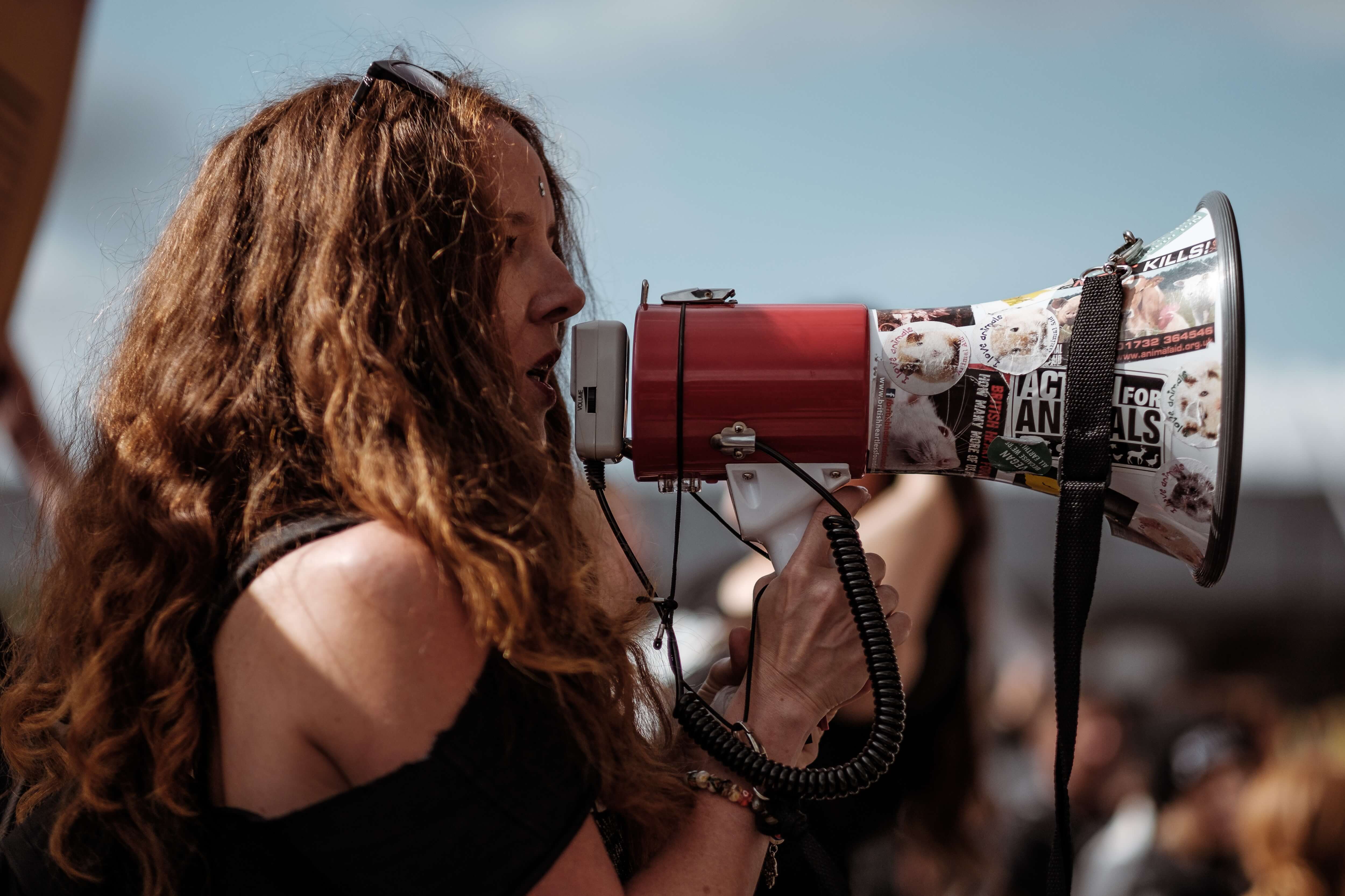 A woman shouting into a megaphone