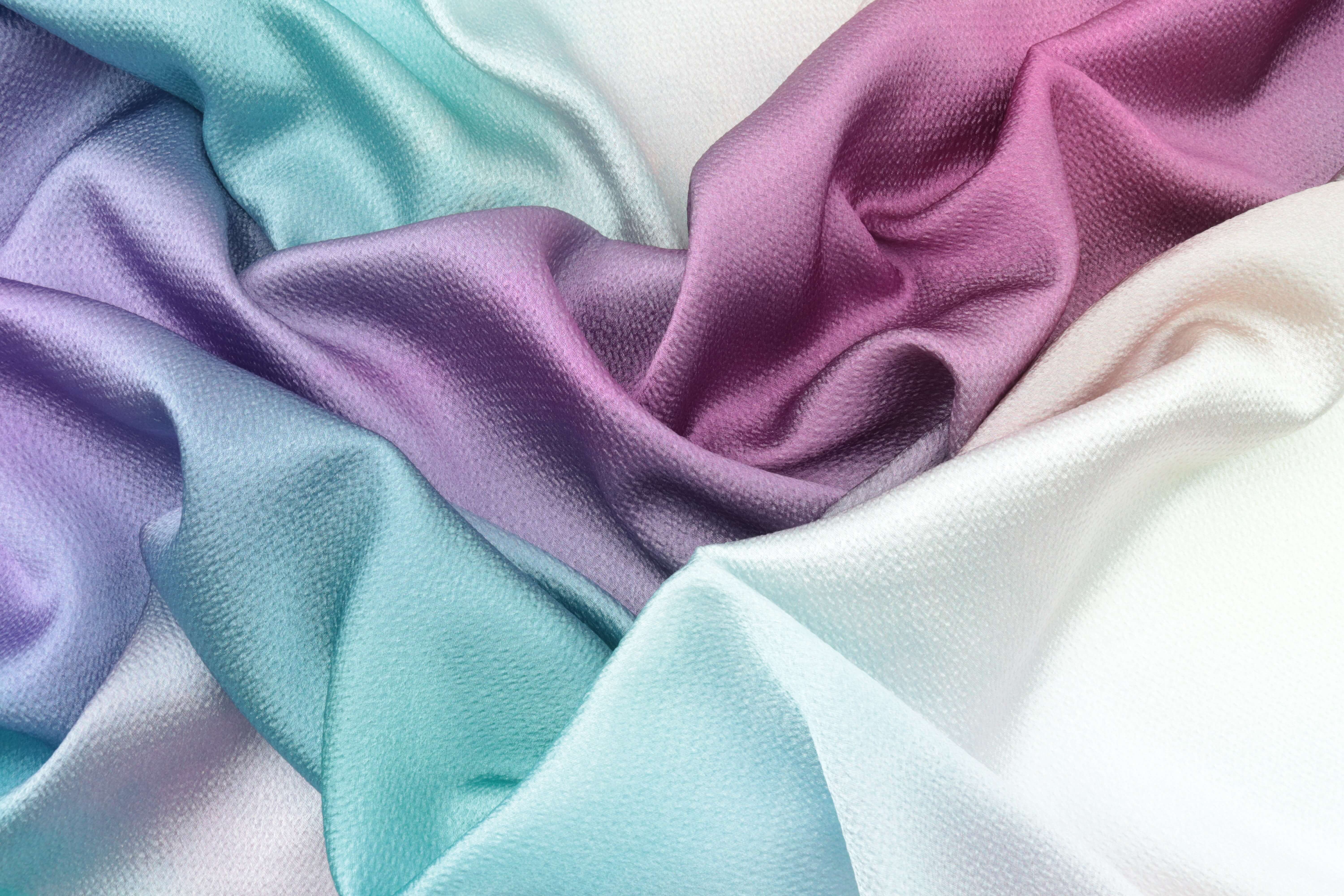 A pile of pastel colored fabric