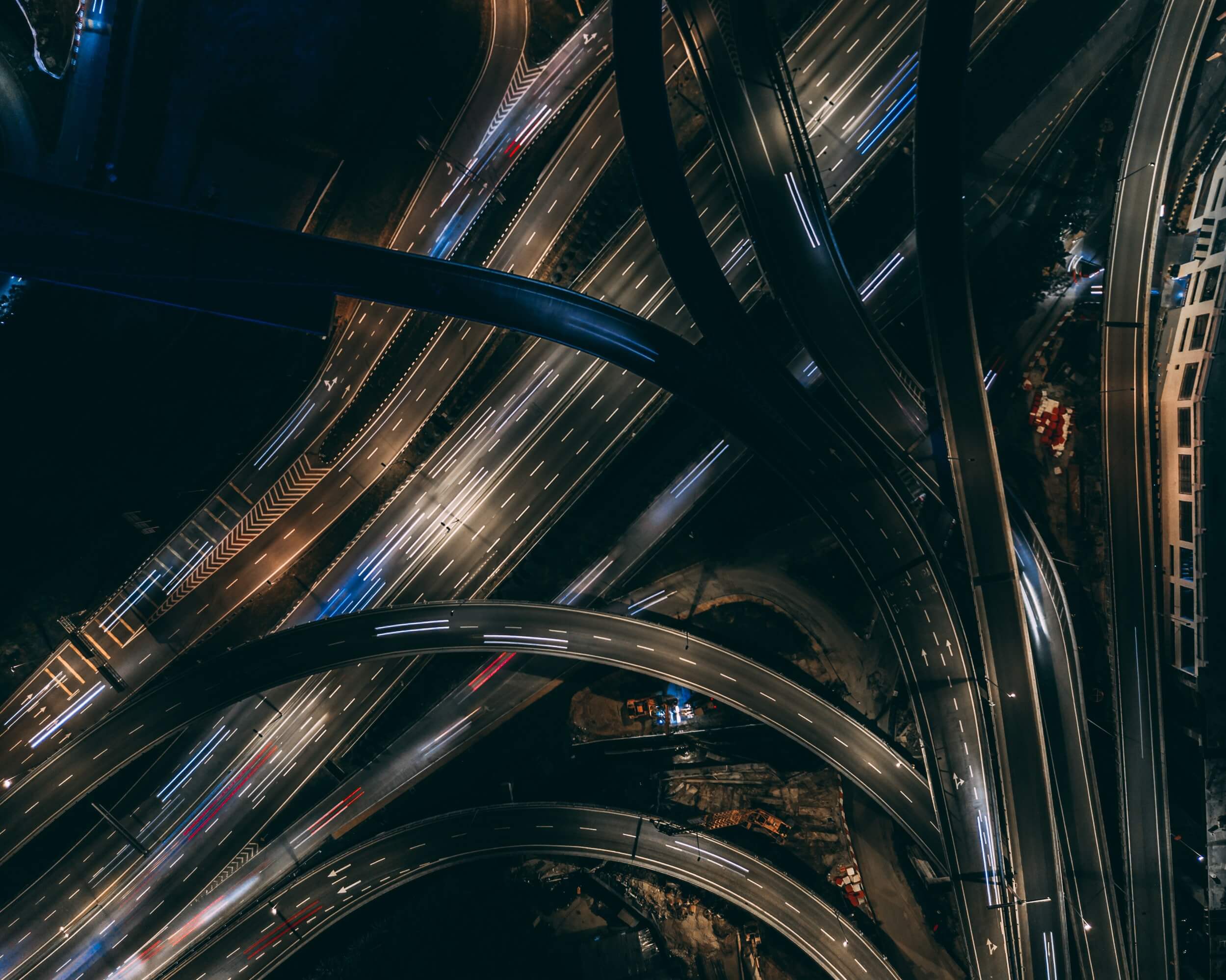 A series of overlapping highways in the dark