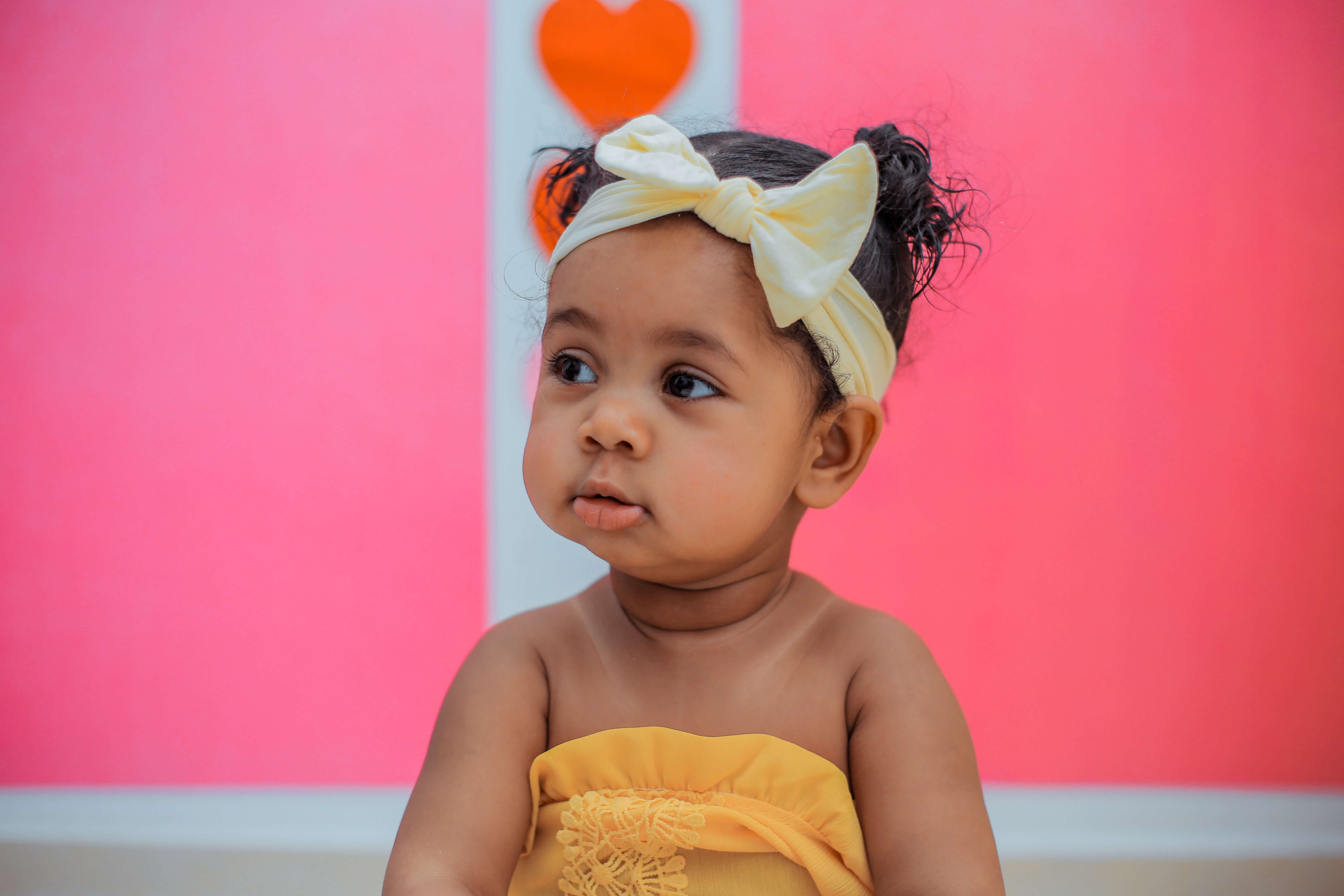 A little kid wearing a soft fabric headband