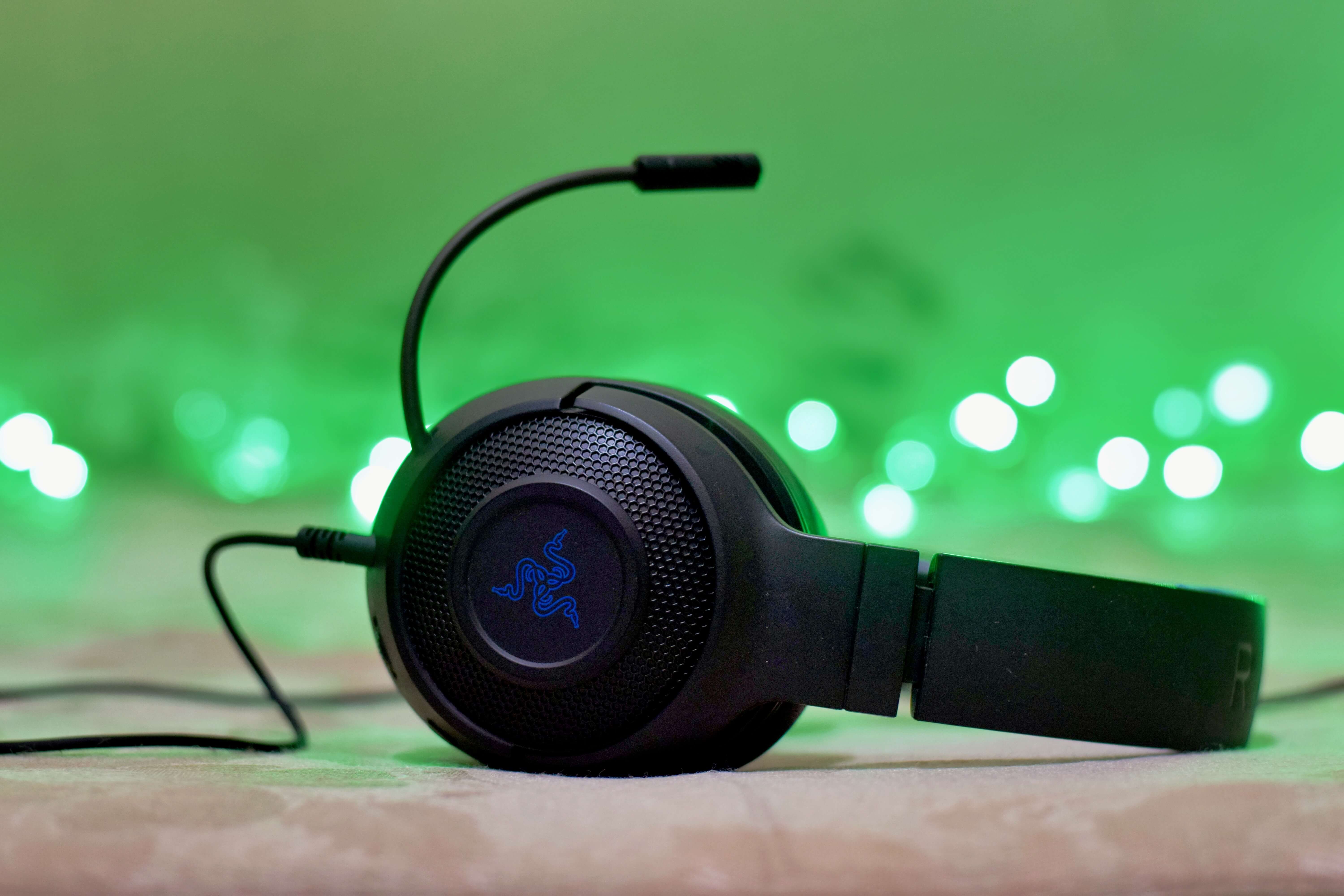 A gaming headset resting on a table. 