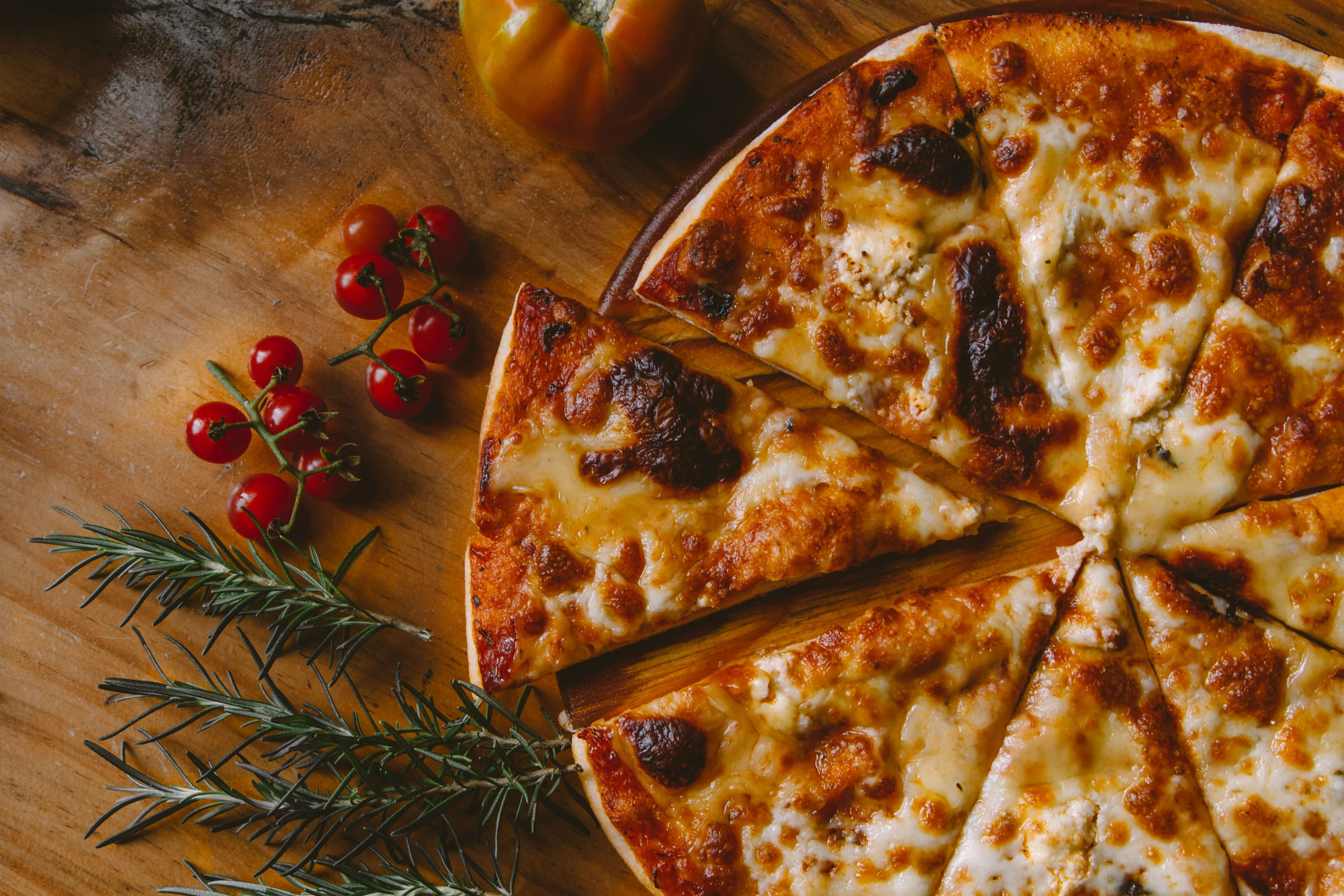 A cheese pizza with one slice removed