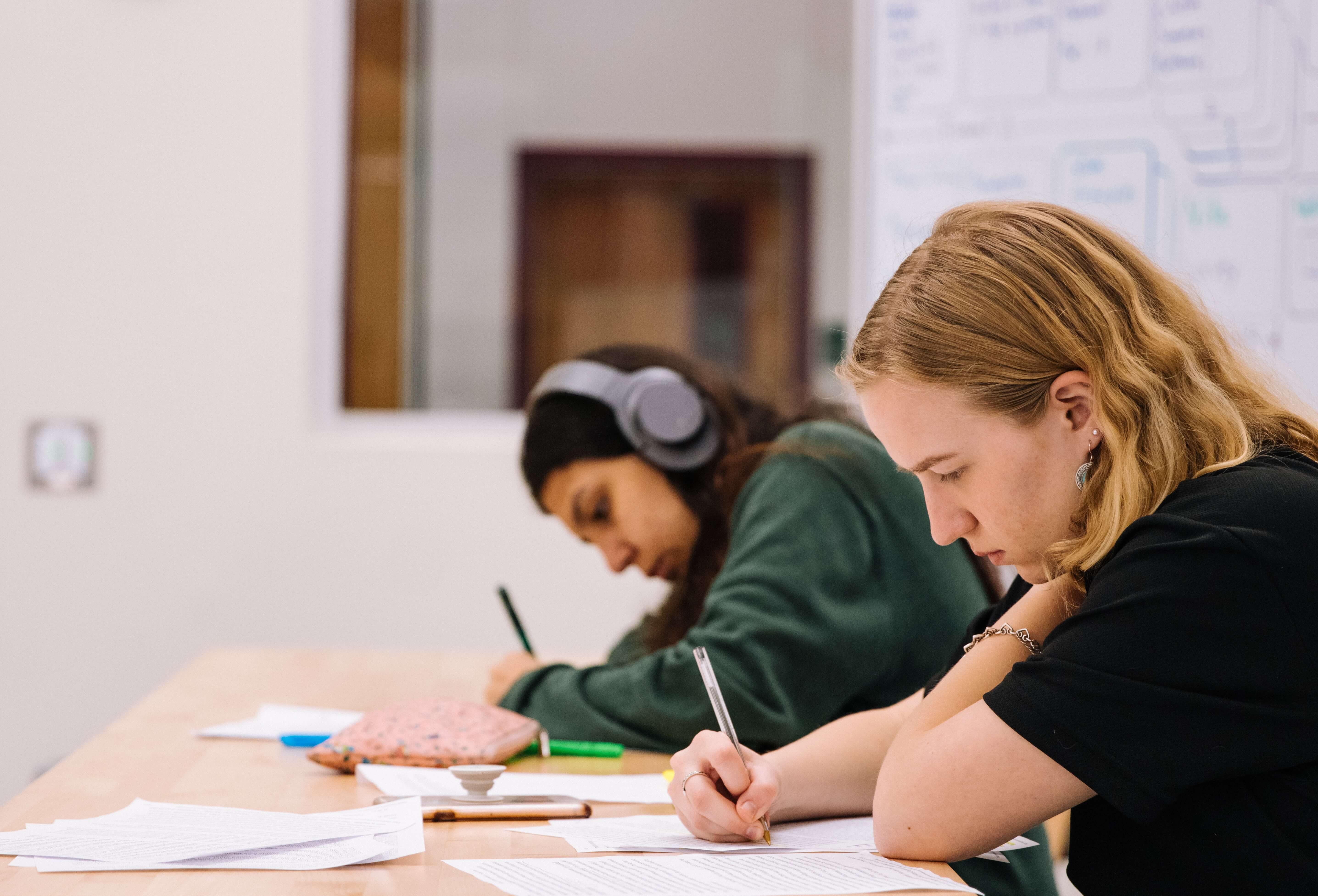 Two teenagers doing schoolwork