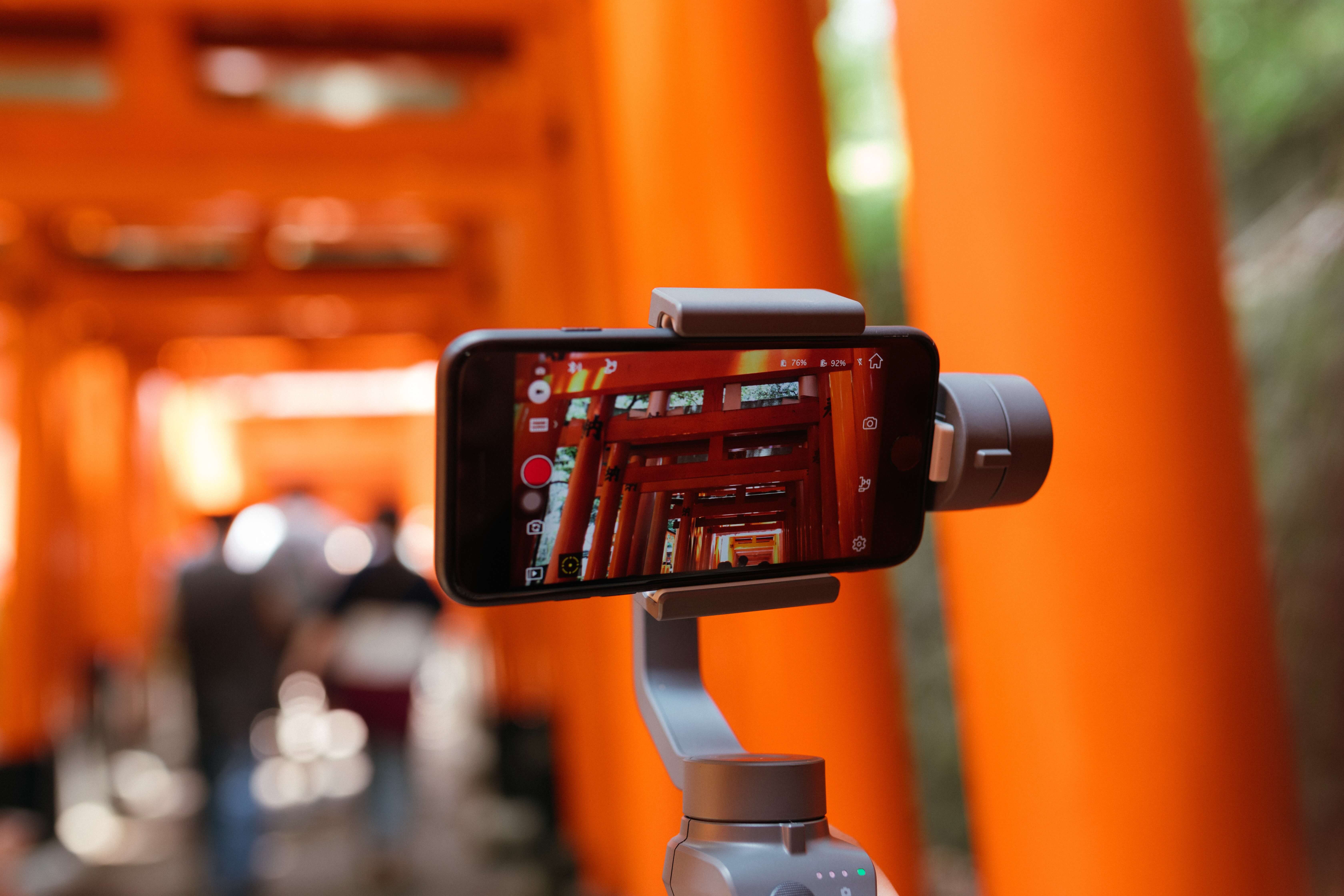 A smartphone recording a video on a tripod
