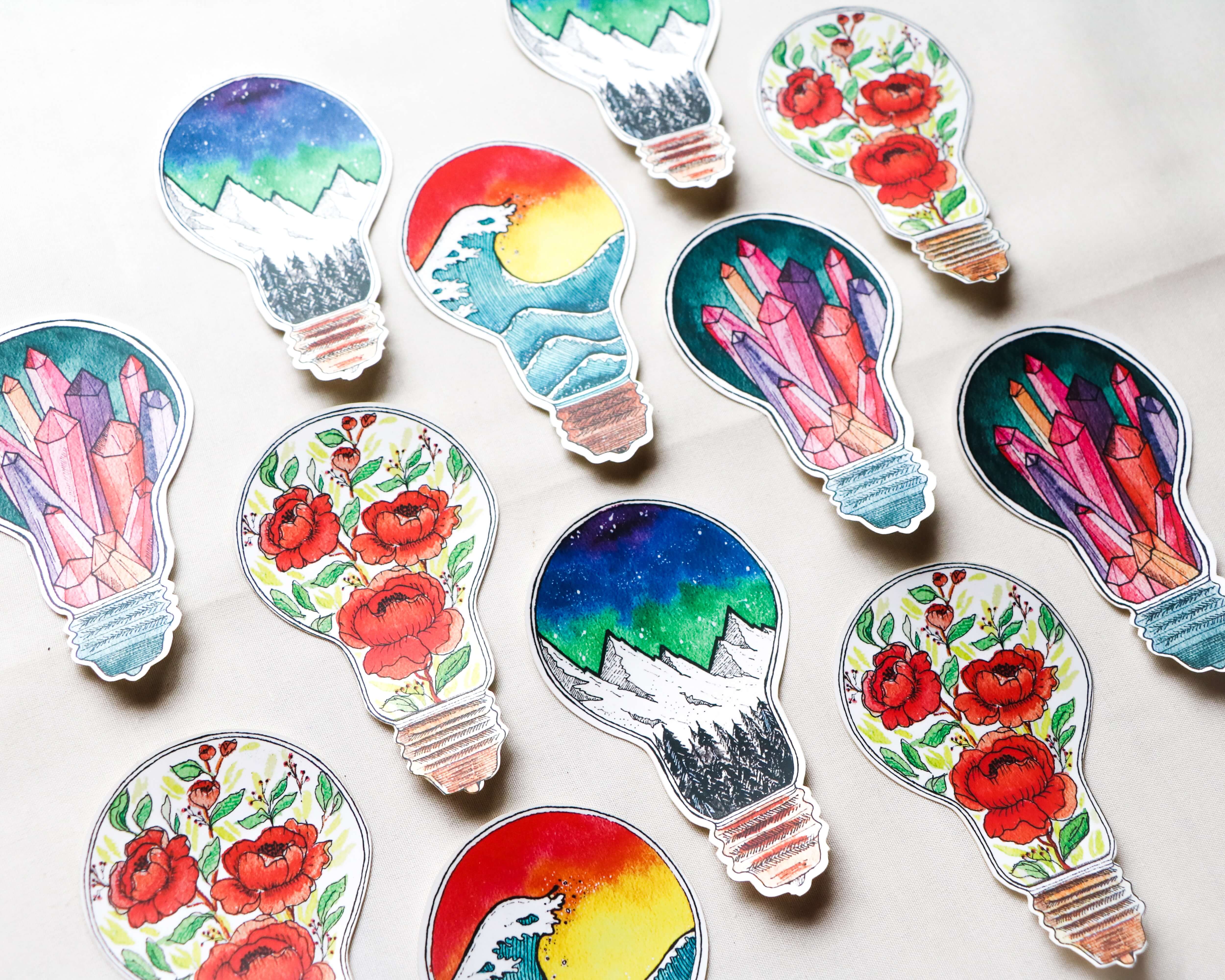 Lightbulb stickers with various designs inside the bulb