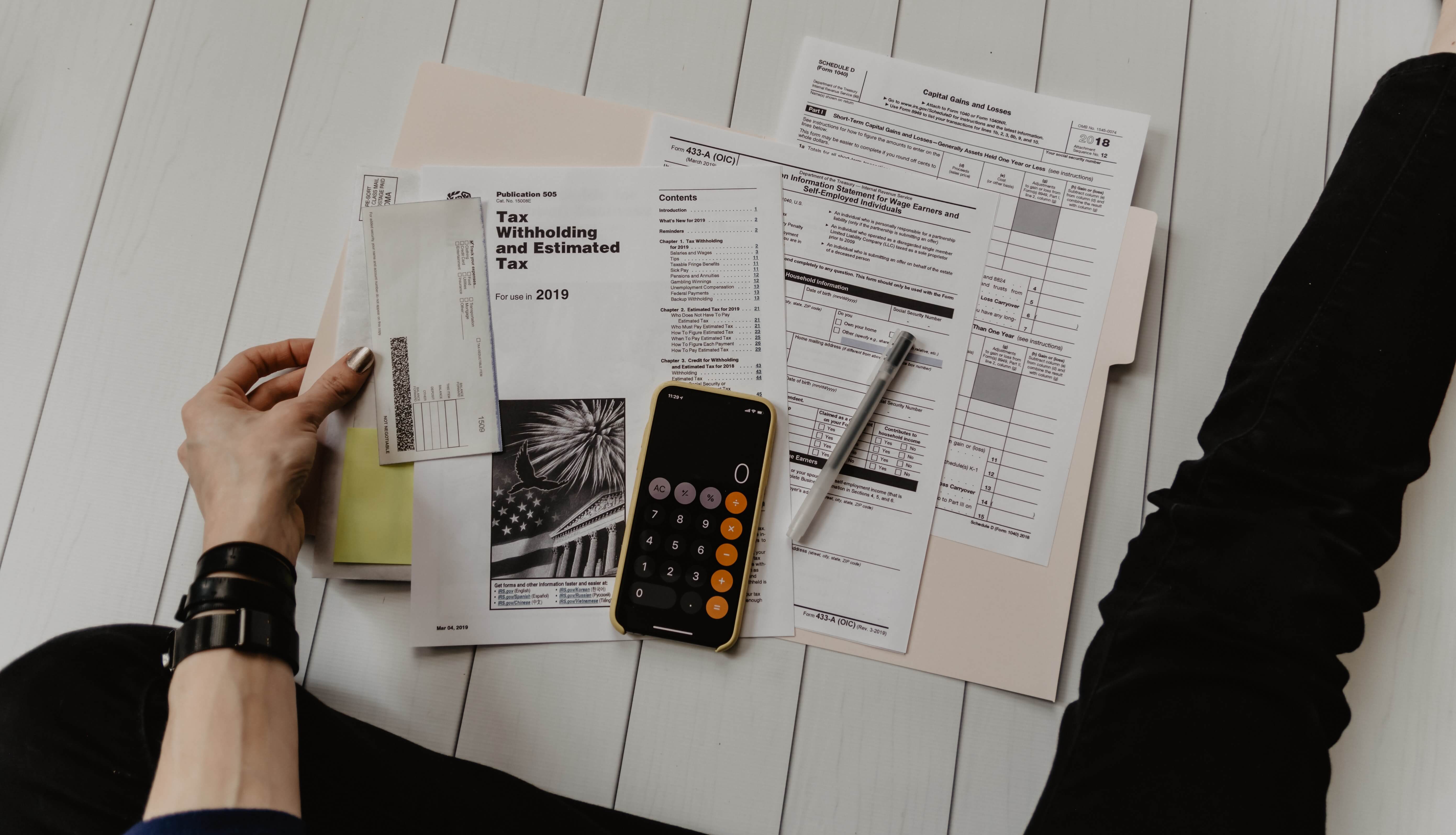 A person looking at tax documents