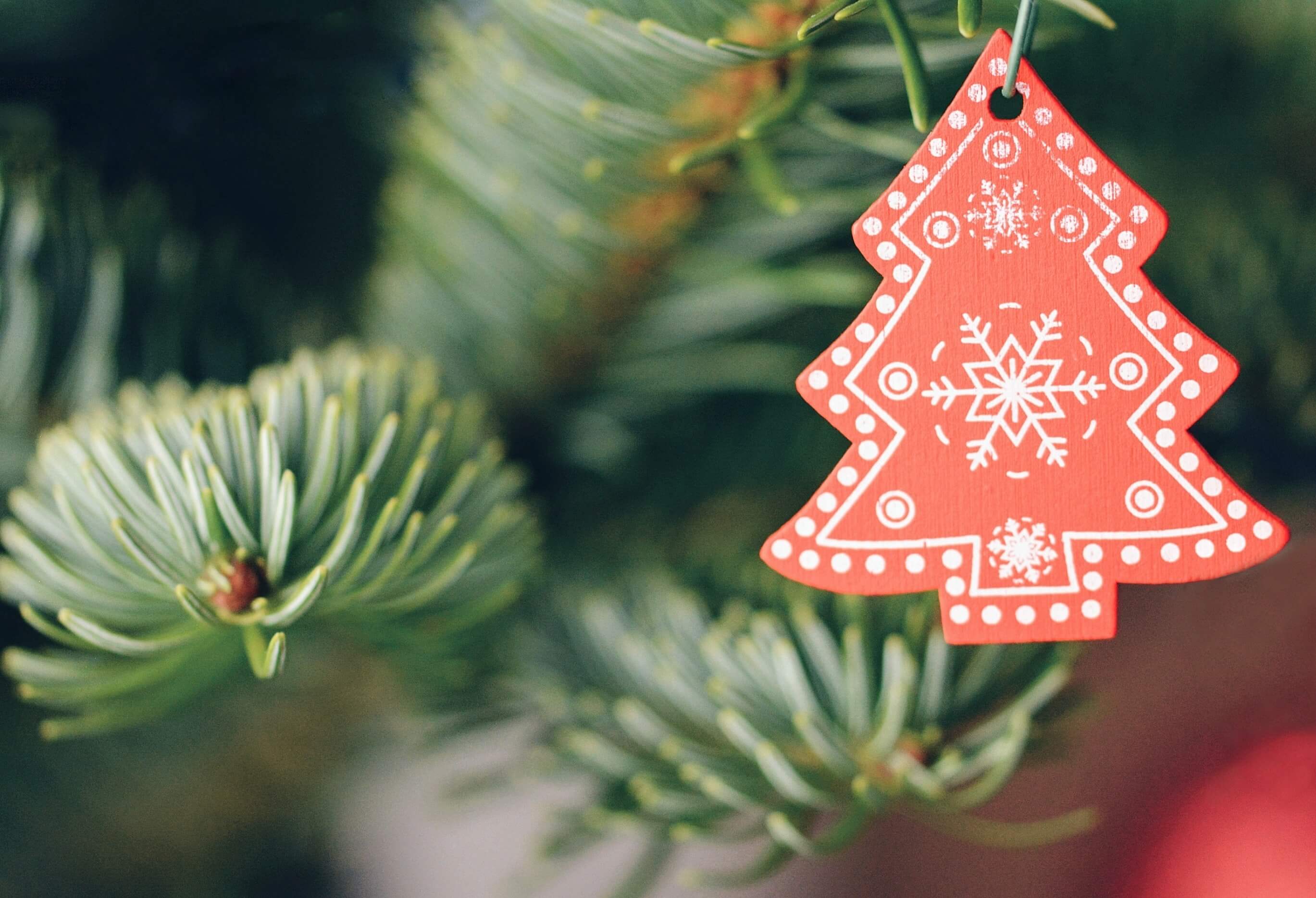 A red Christmas tree-shaped ornament