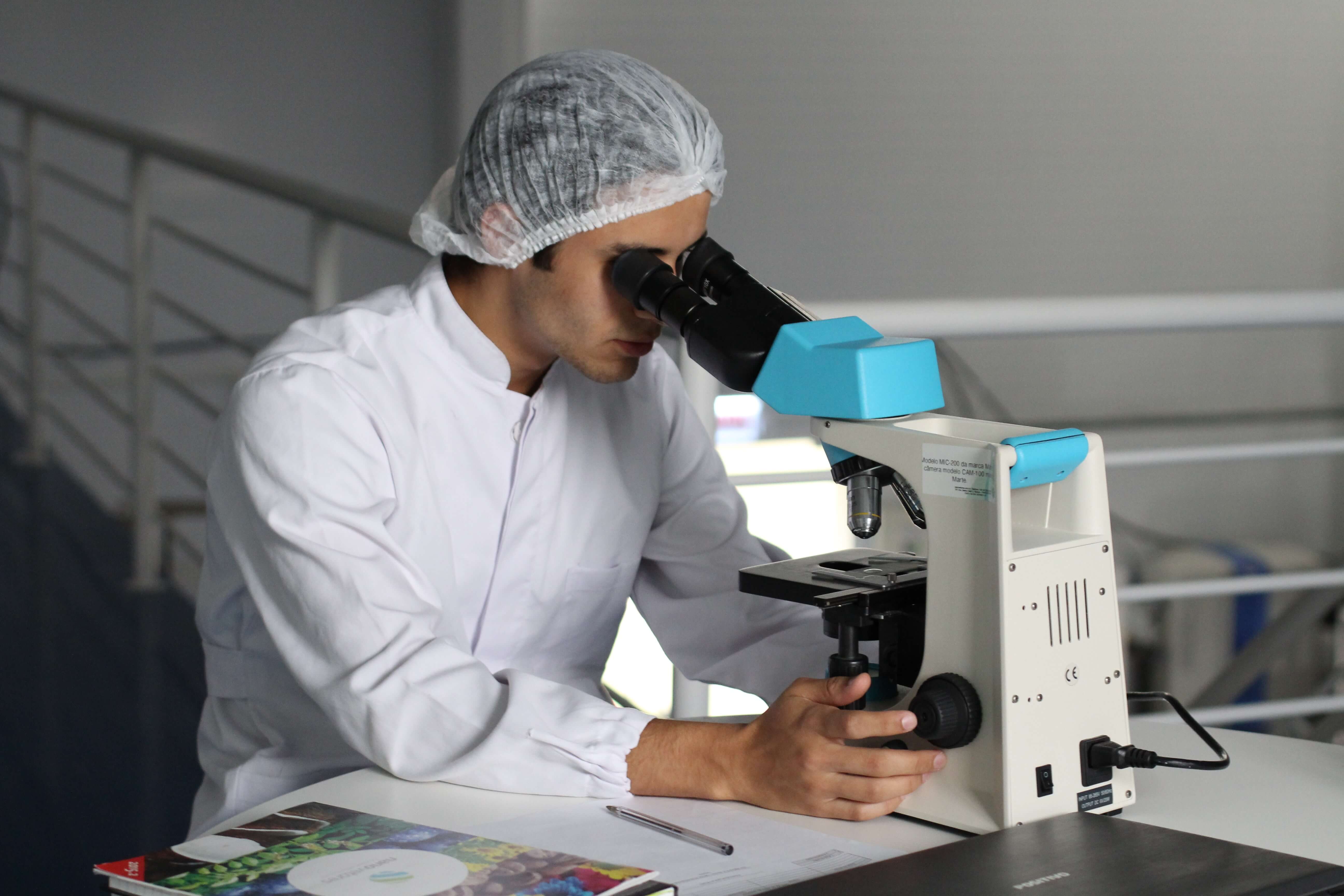 A scientist using a microscope