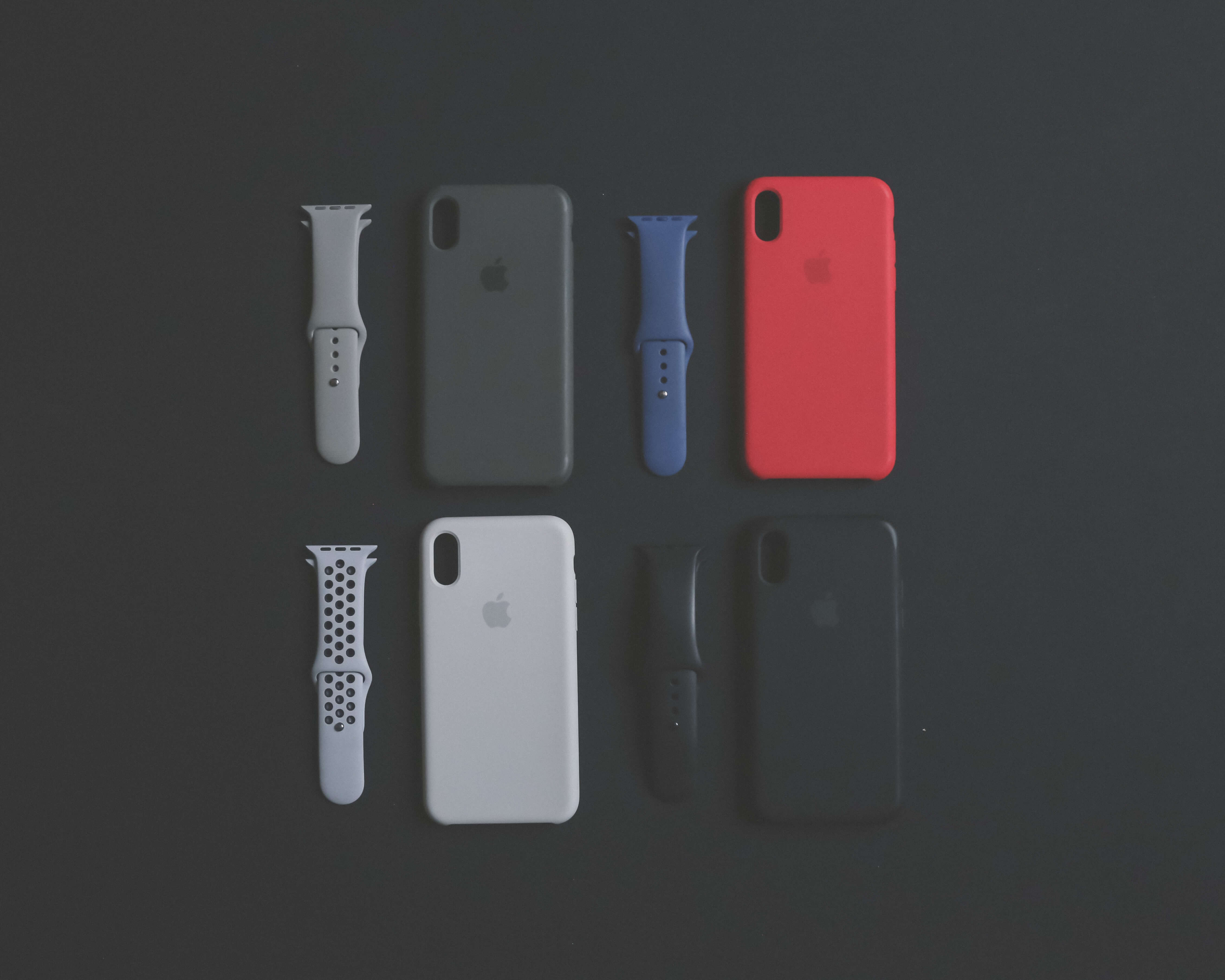 Different colored iPhone cases and watch straps