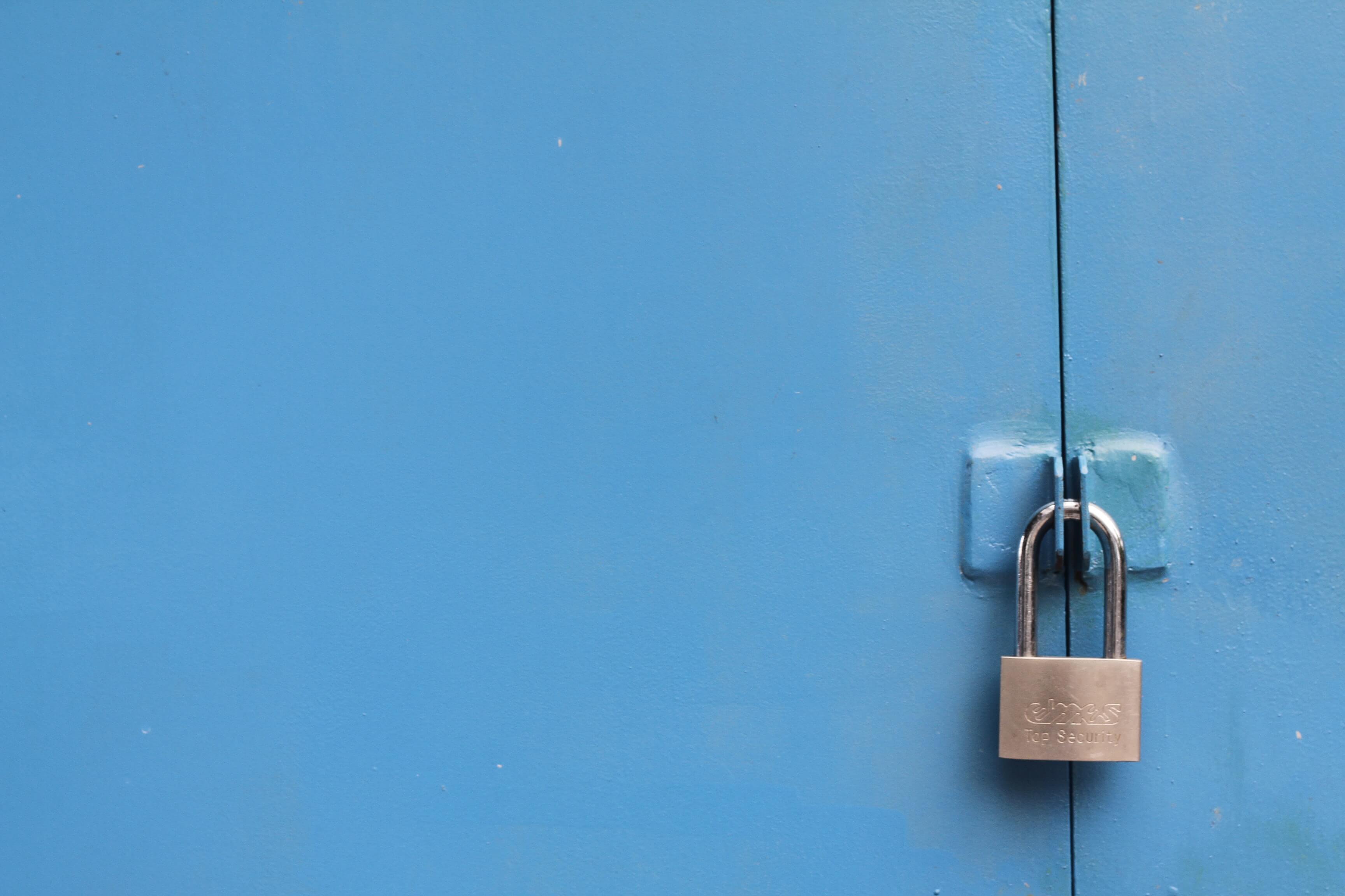 A padlock on a shed door