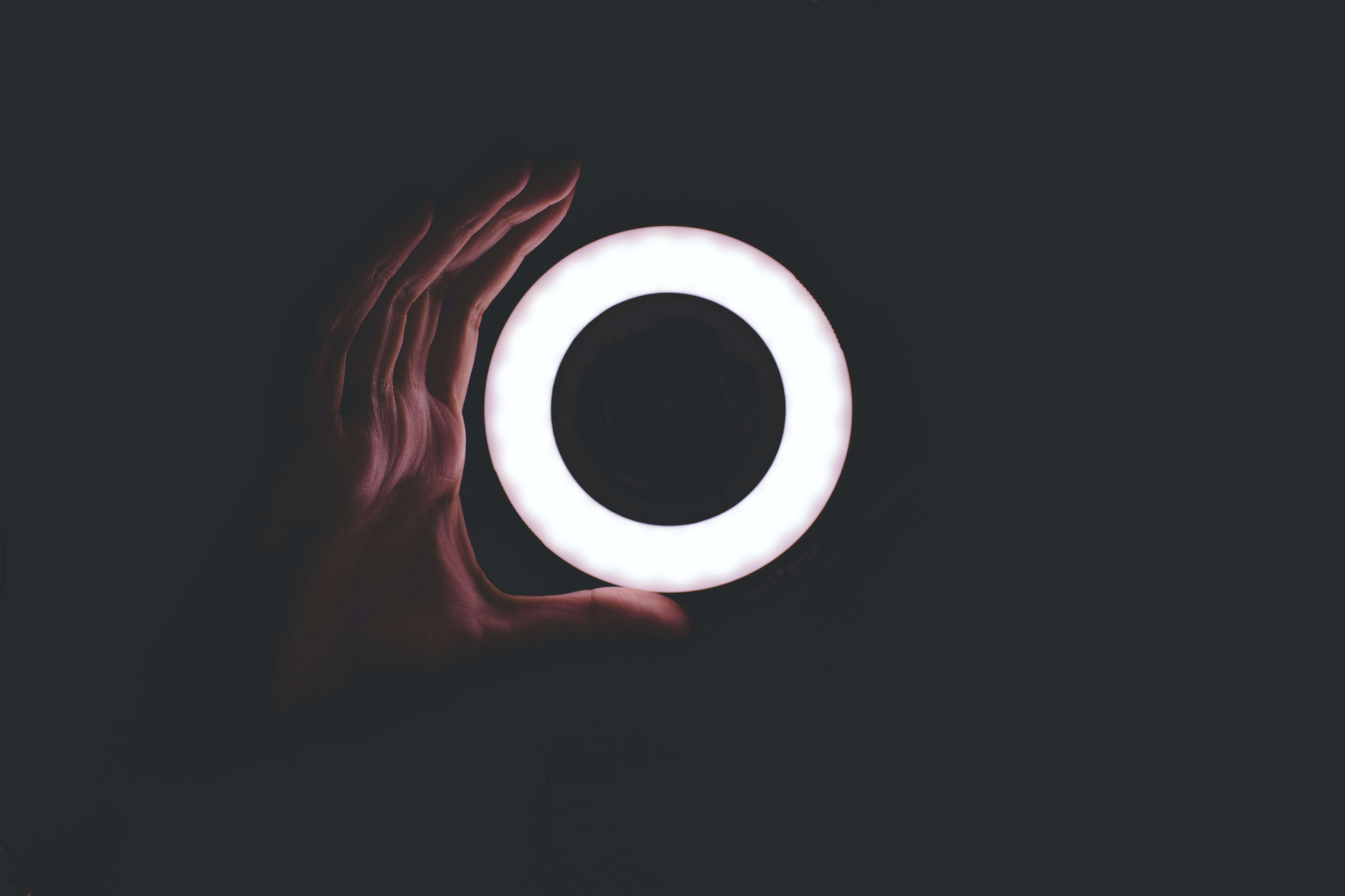 A ring light against a dark background. 