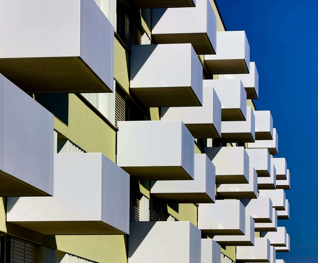 A modern, geometric apartment complex