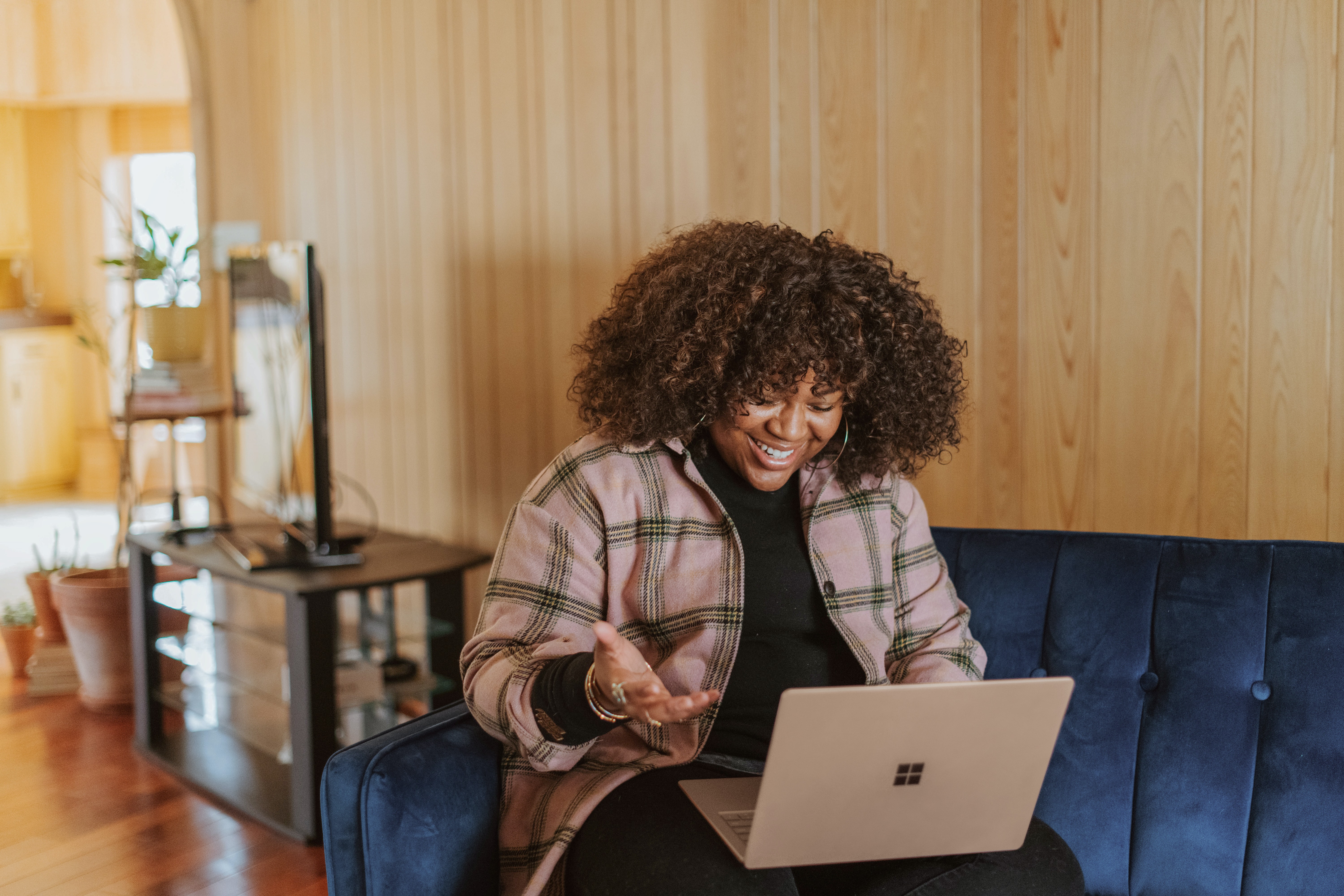A black woman using a laptop