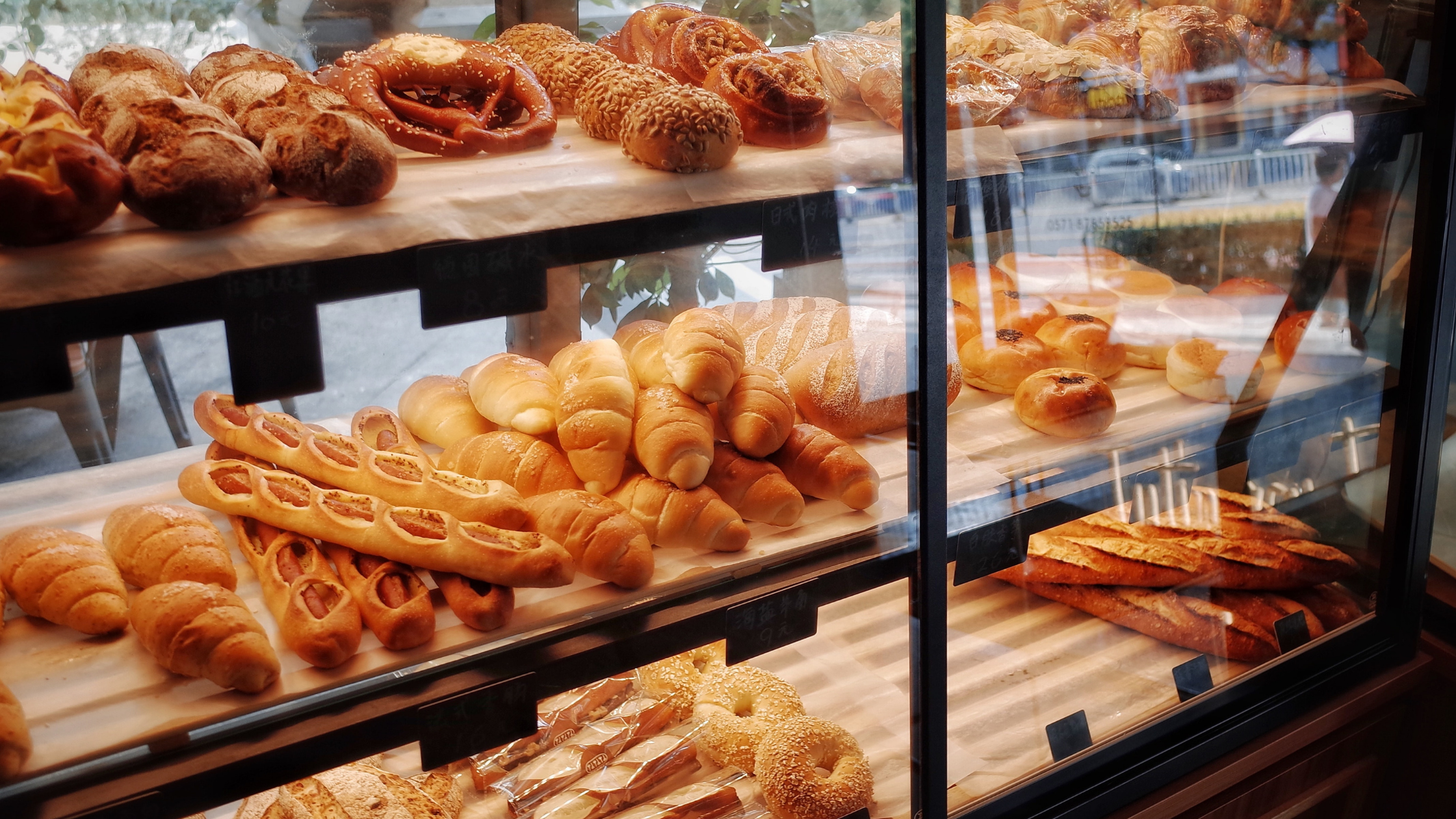 An assortment of pastries in a glass case