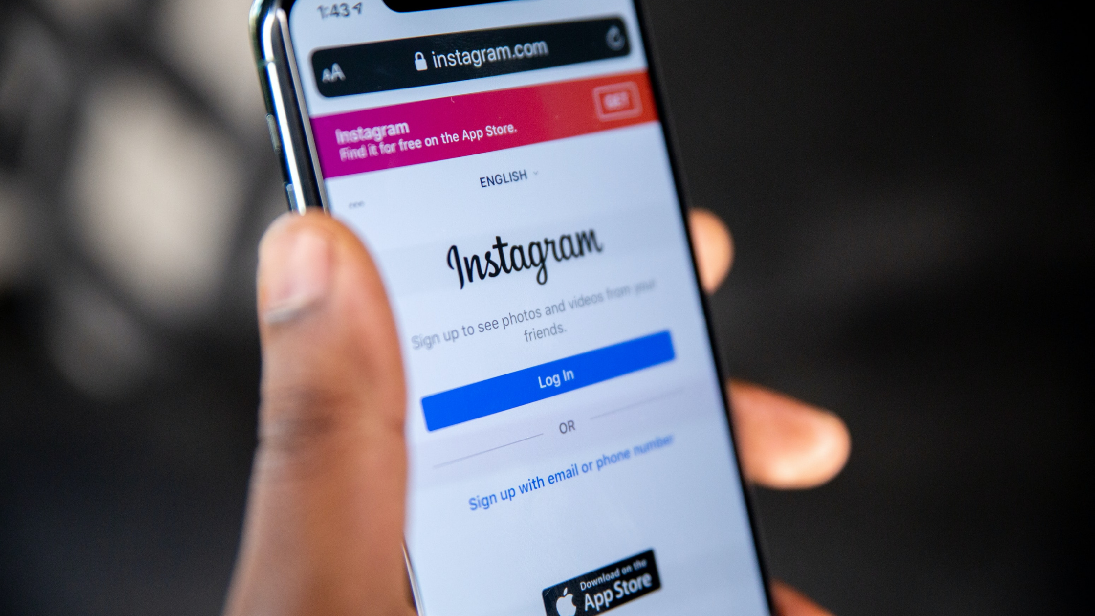 A closeup of a person logging in to Instagram on a smartphone