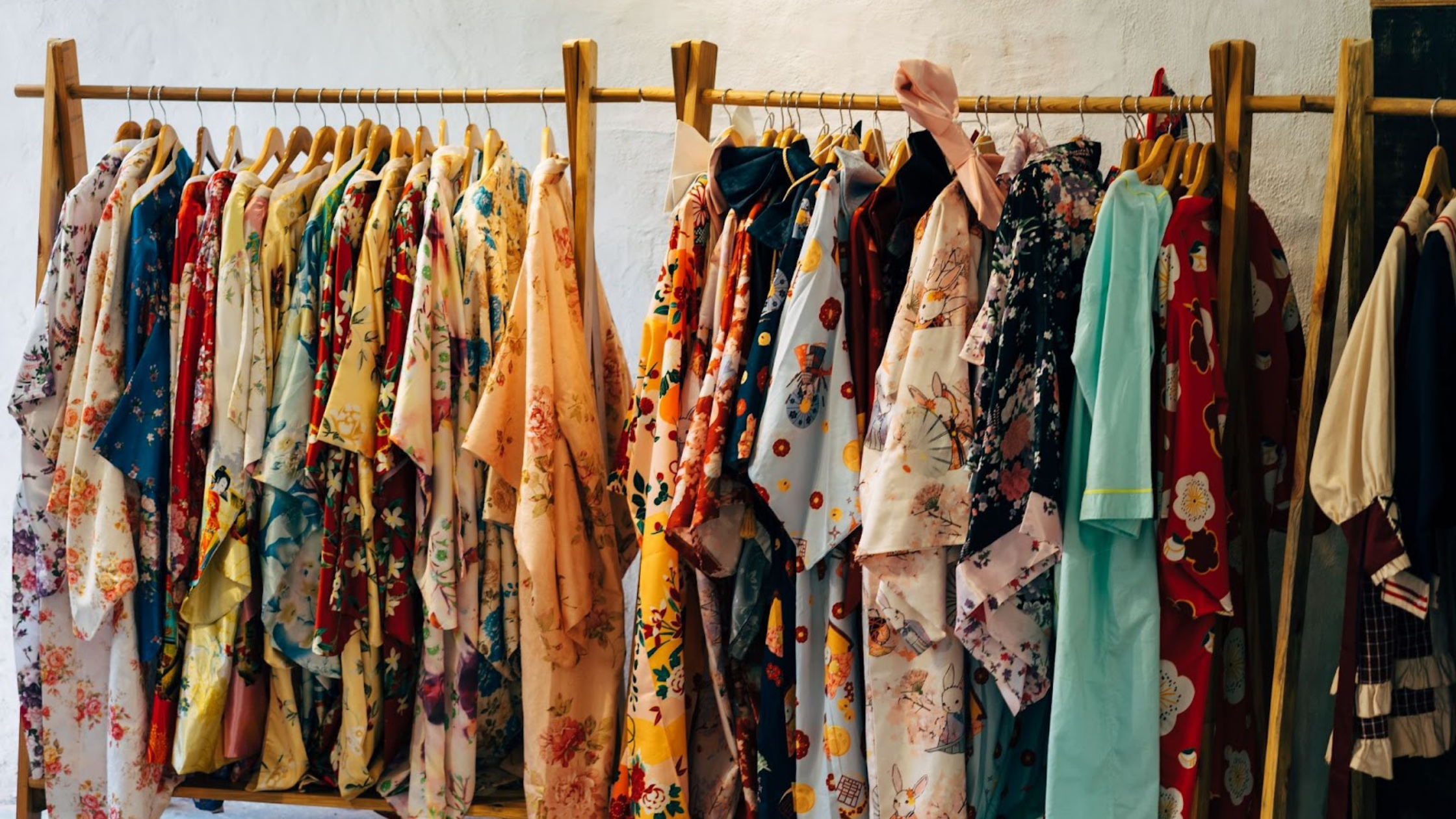 A rack of floral tops